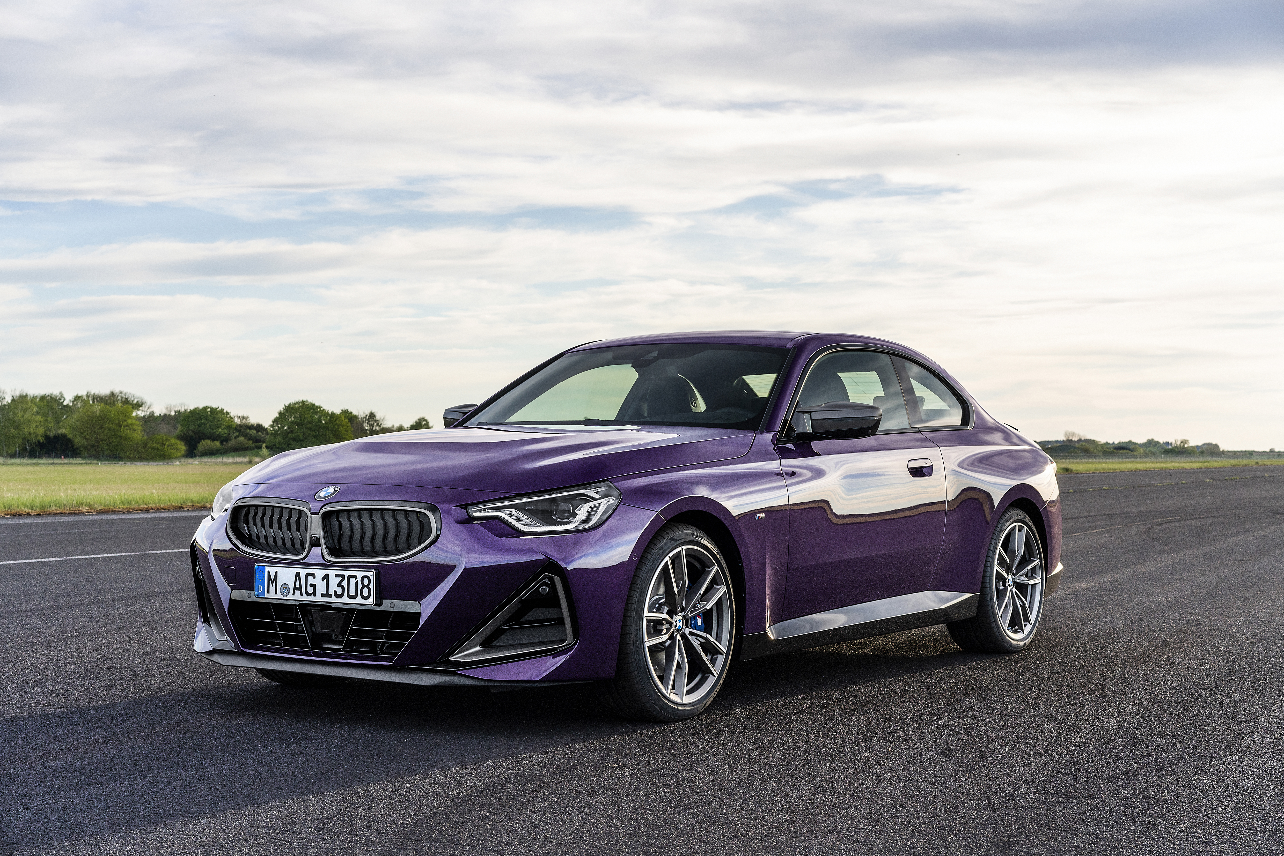 Purple BMW M240i xDrive Coupé on a Racetrack HD Wallpaper