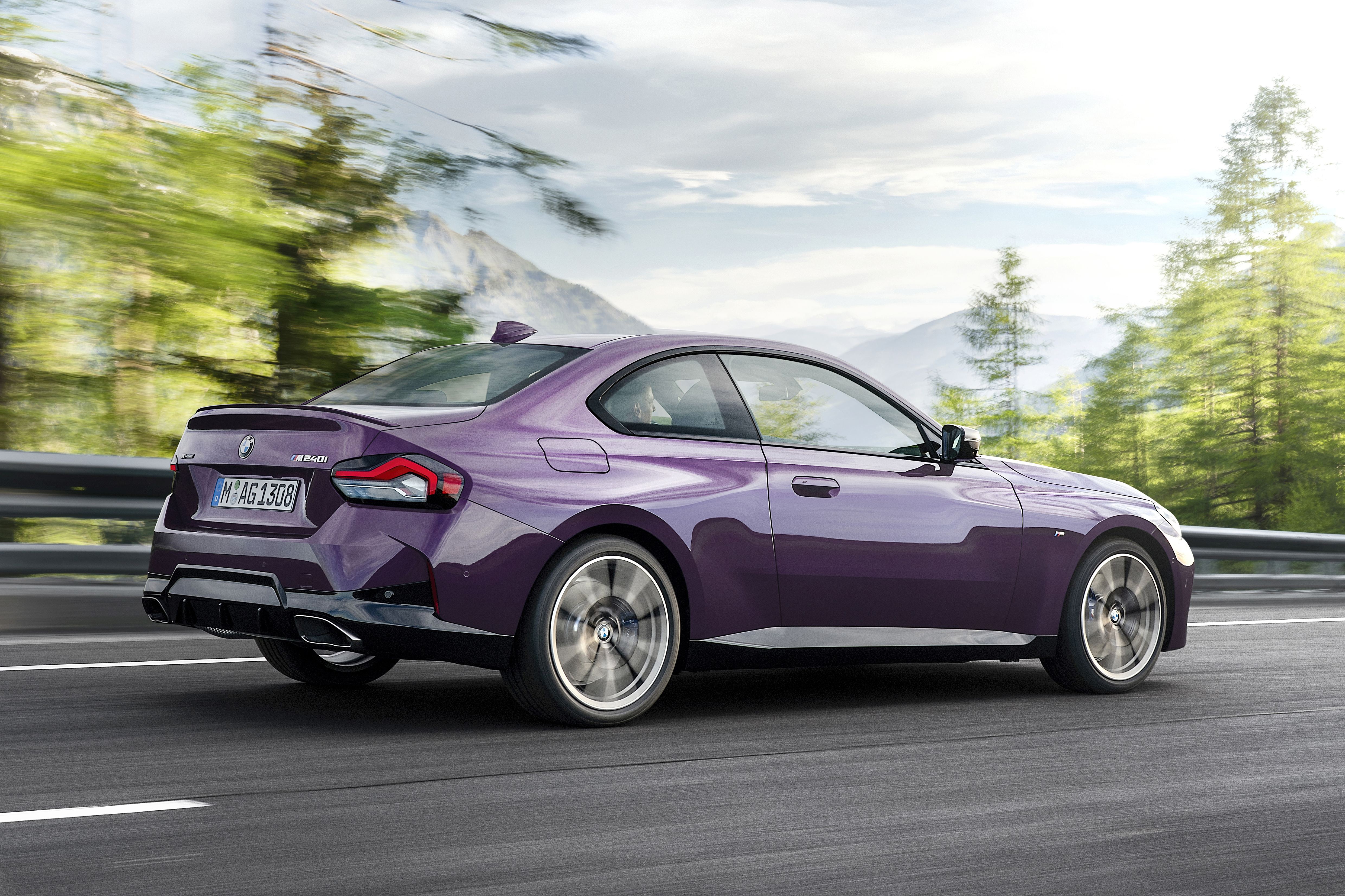 Purple BMW M240i xDrive Coupé driving on a road HD Wallpaper