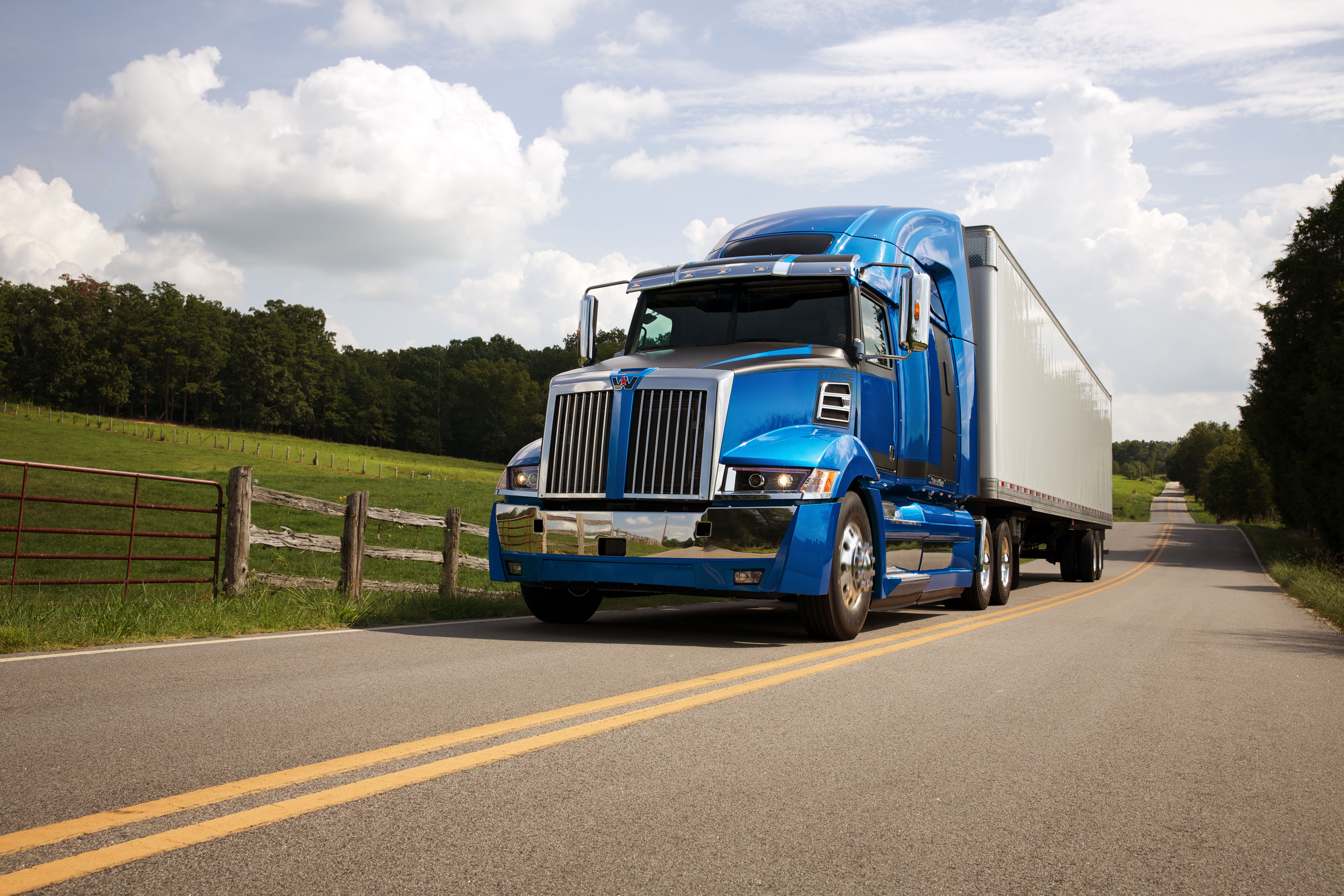 Blue Western Star 4K Truck on a Country Road HD Wallpaper