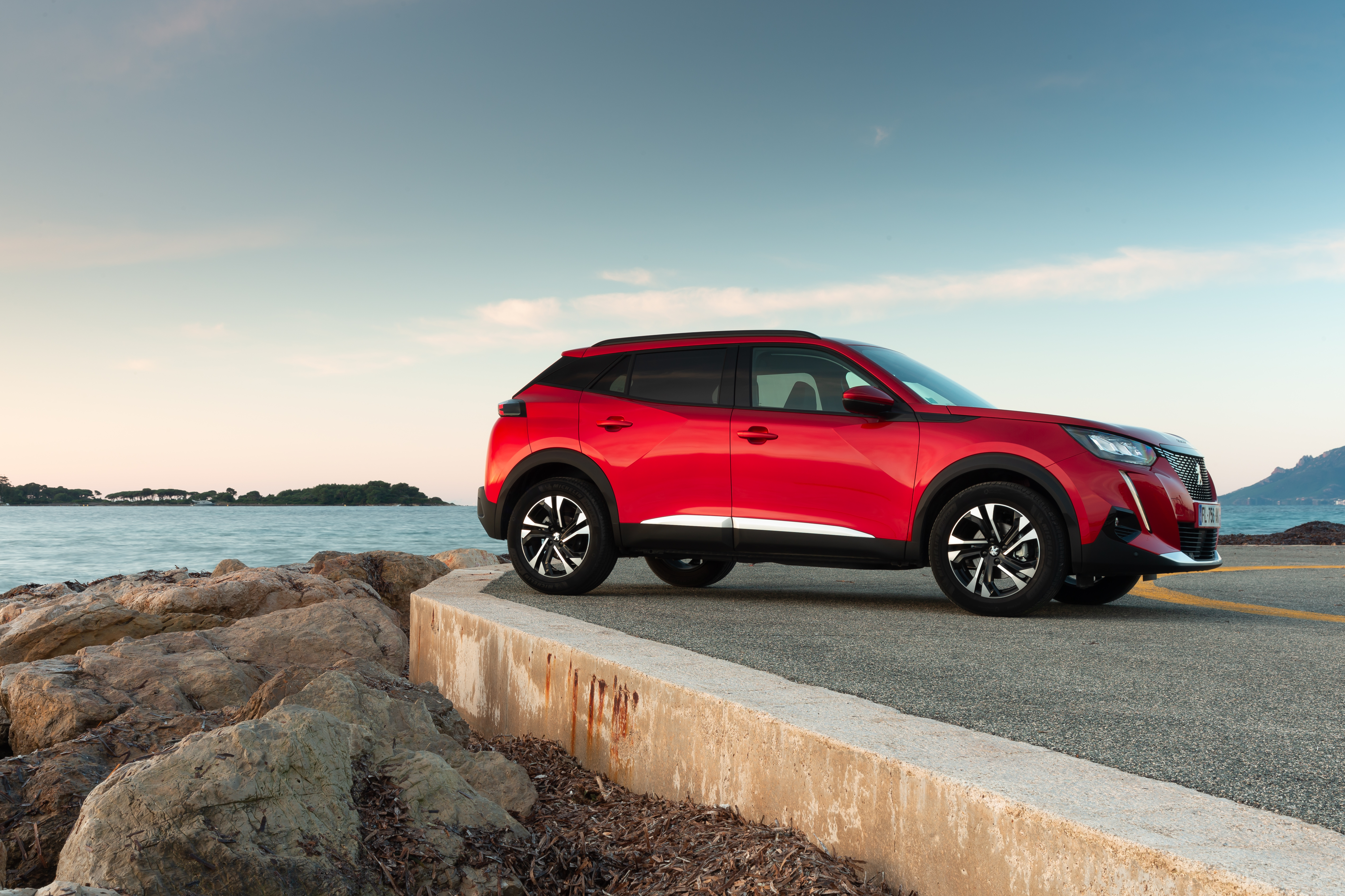 Red Peugeot 2008 SUV by the sea HD Wallpaper