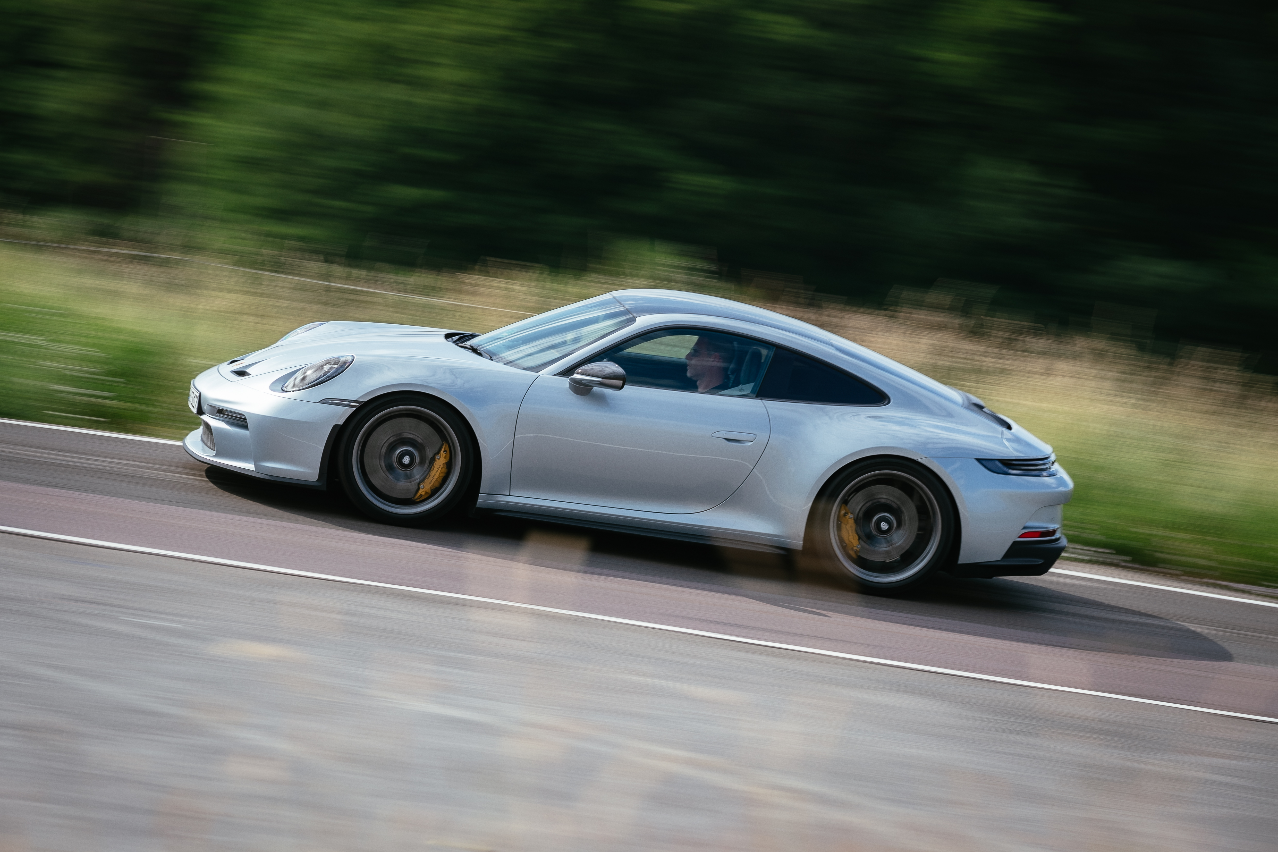 Silver Porsche 911 GT3 Touring driving on a track HD Wallpaper