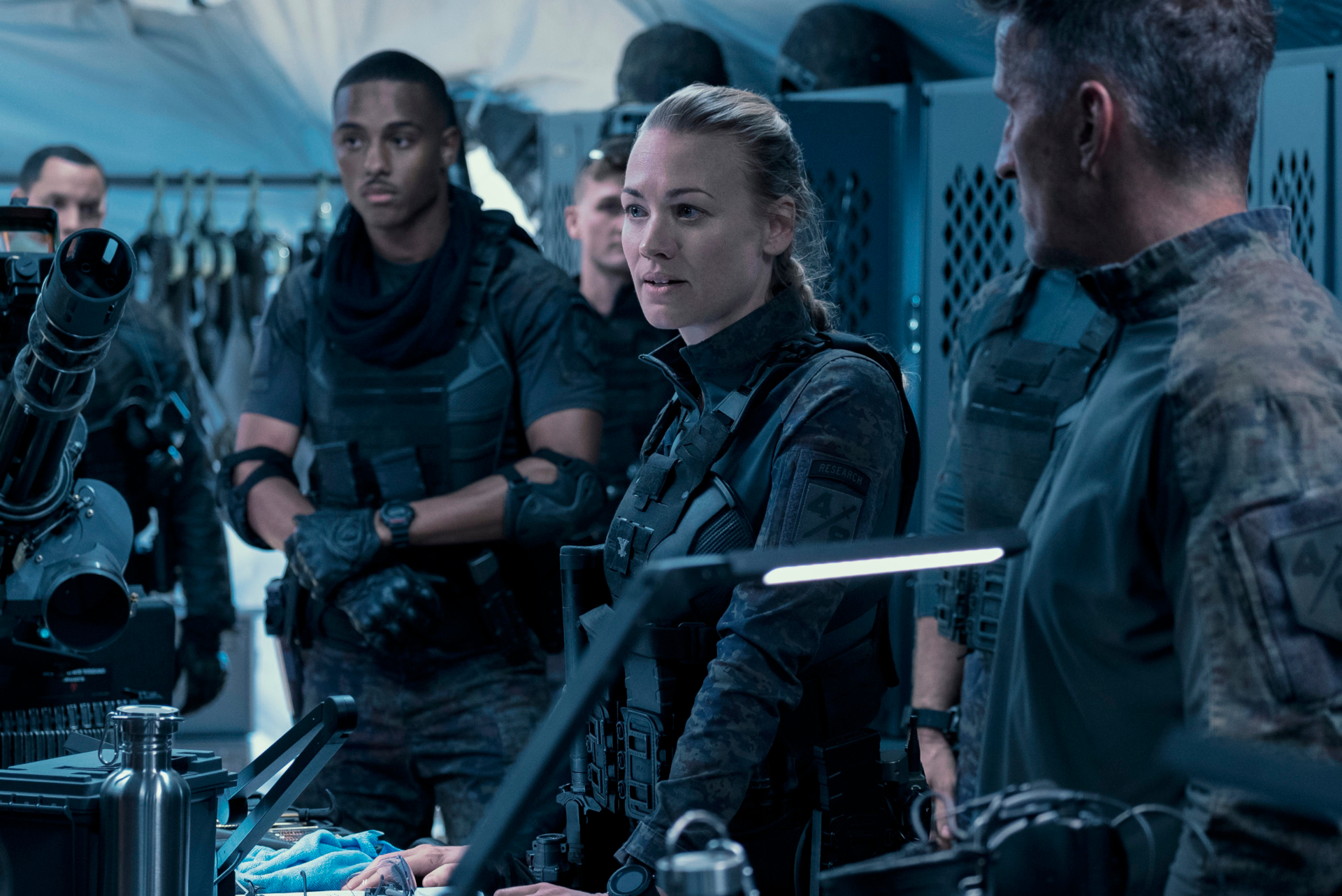 Yvonne Strahovski and Keith Powers in military gear HD Wallpaper