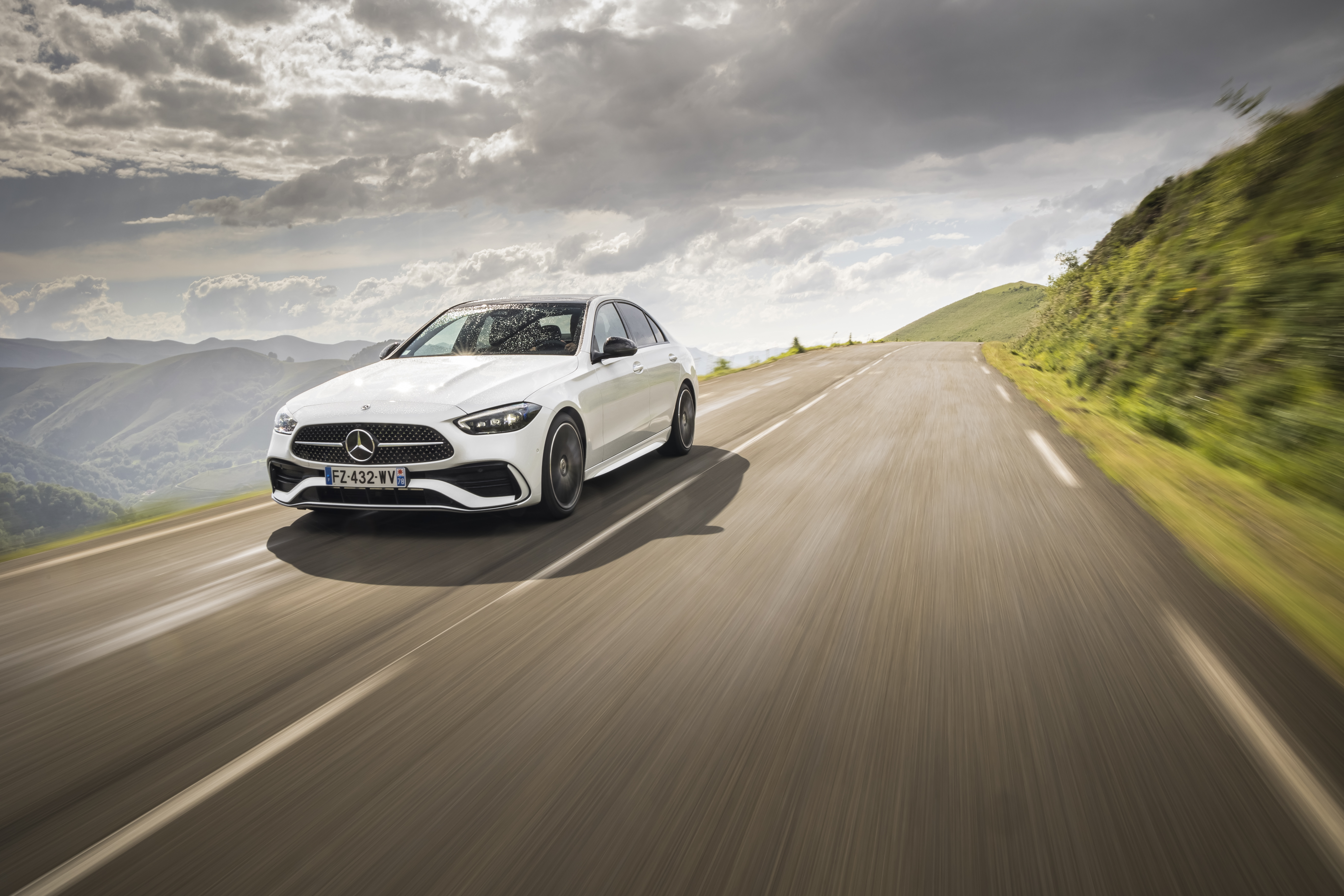 White Mercedes-Benz C 220 d AMG Line on a Mountain Road HD Wallpaper