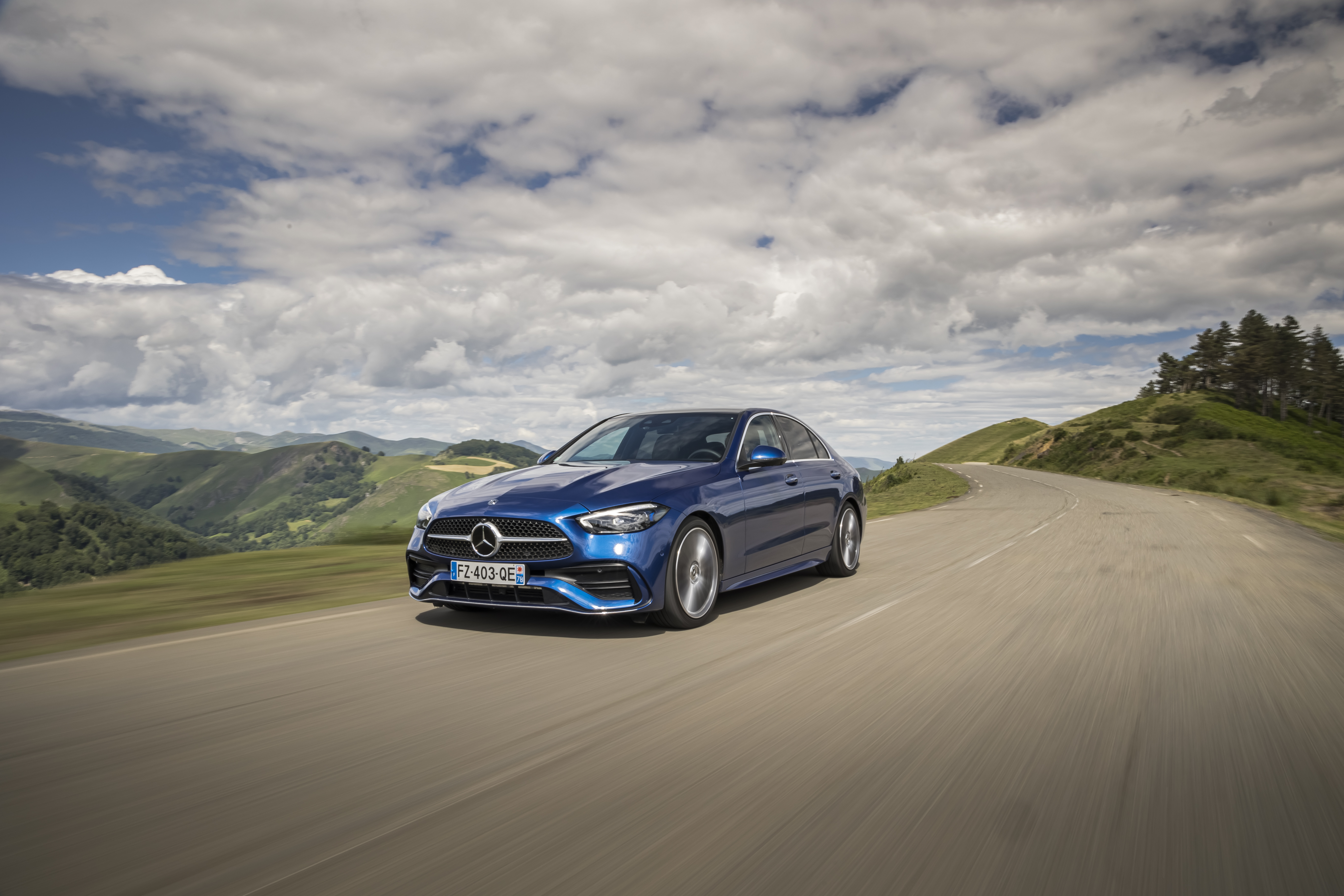 Blue Mercedes-Benz C 200 AMG Line on a Mountain Road HD Wallpaper