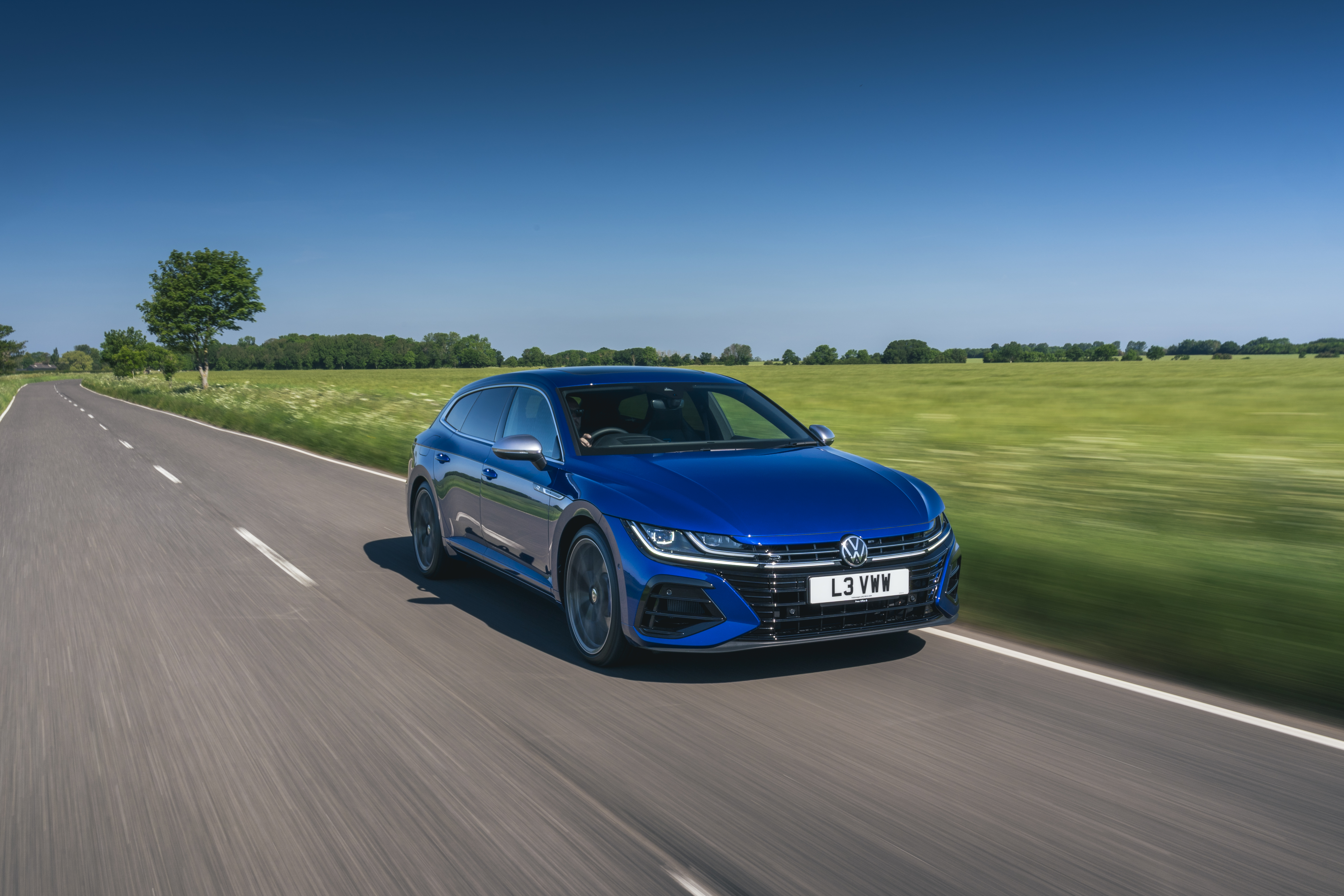 Blue 2021 Volkswagen Arteon Shooting Brake R driving on a road HD Wallpaper
