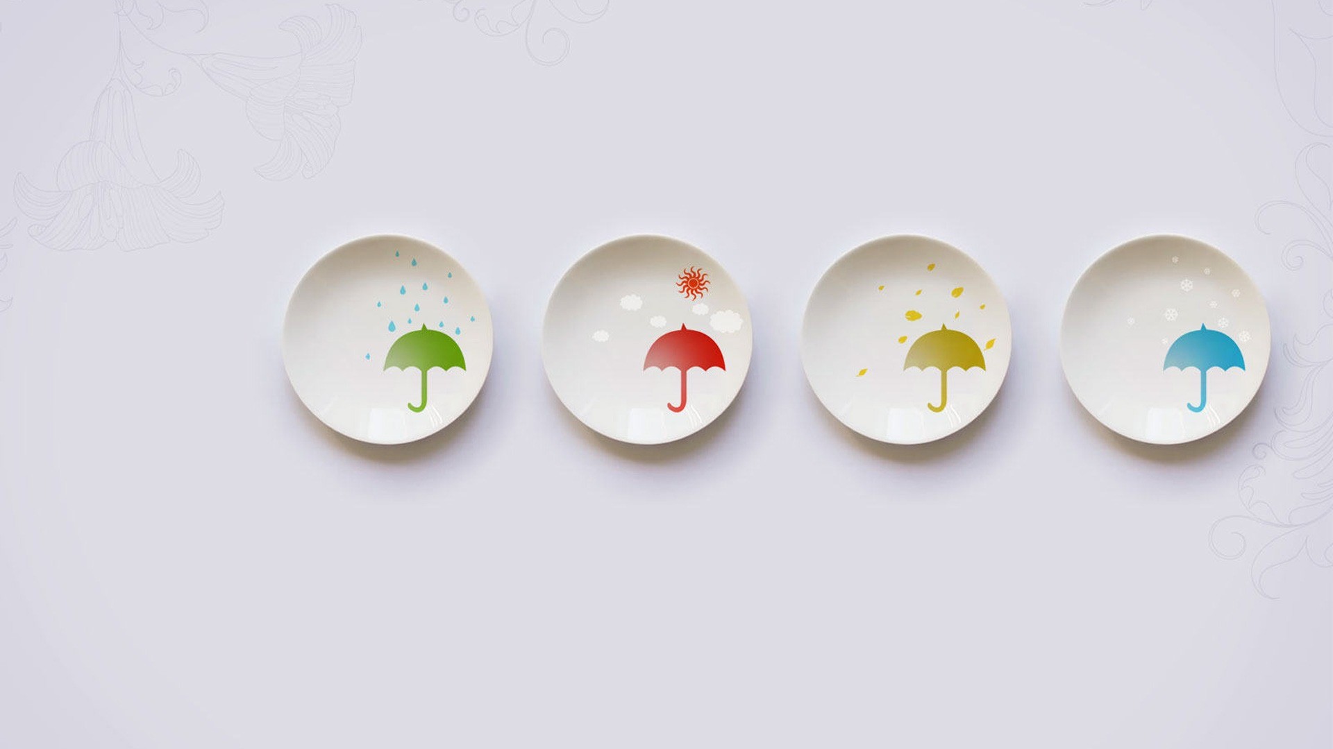Four plates with seasonal umbrella designs HD Wallpaper