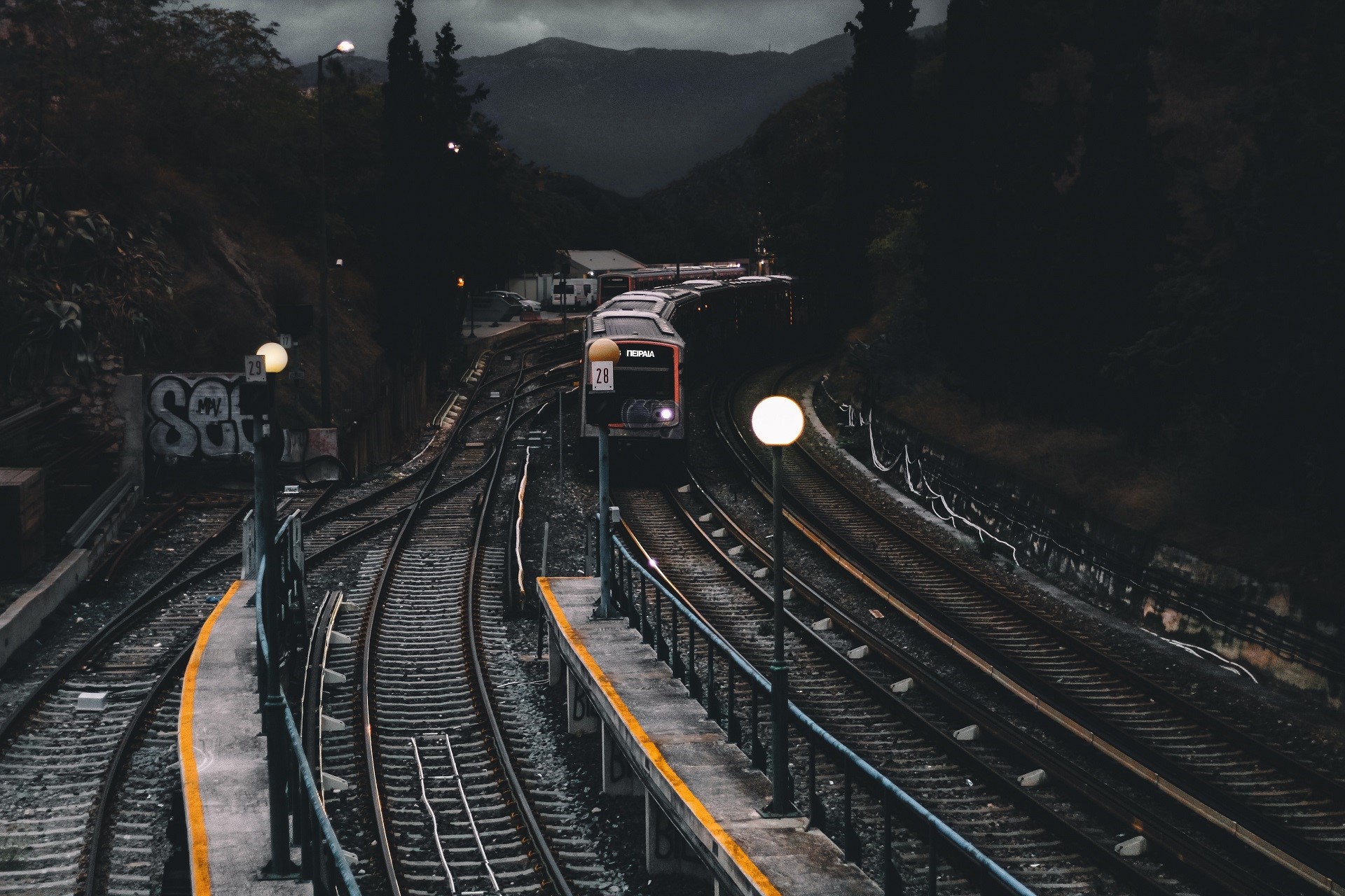 Train on railway tracks at dusk HD Wallpaper