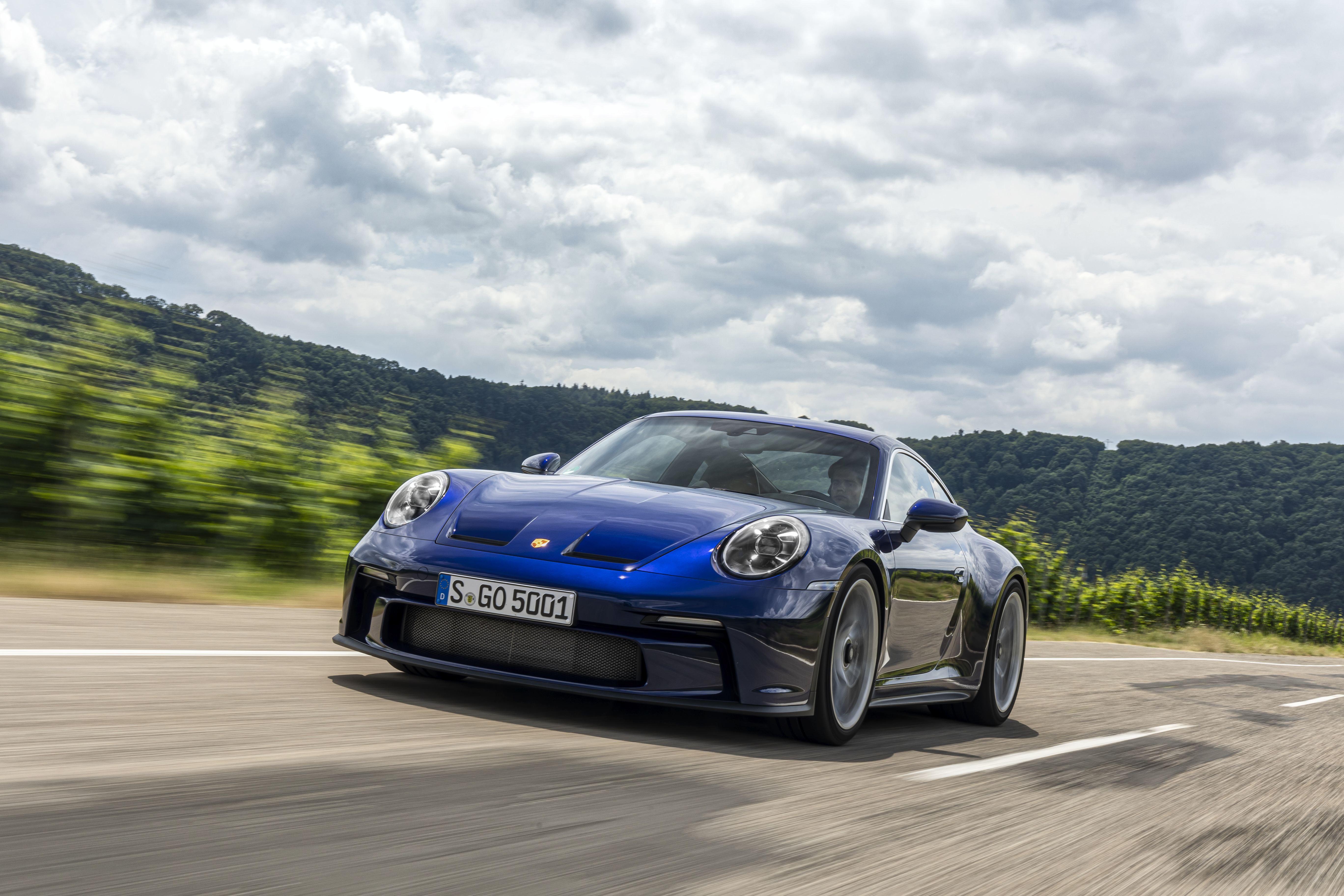 Blue Porsche 911 GT3 Touring driving on a road HD Wallpaper