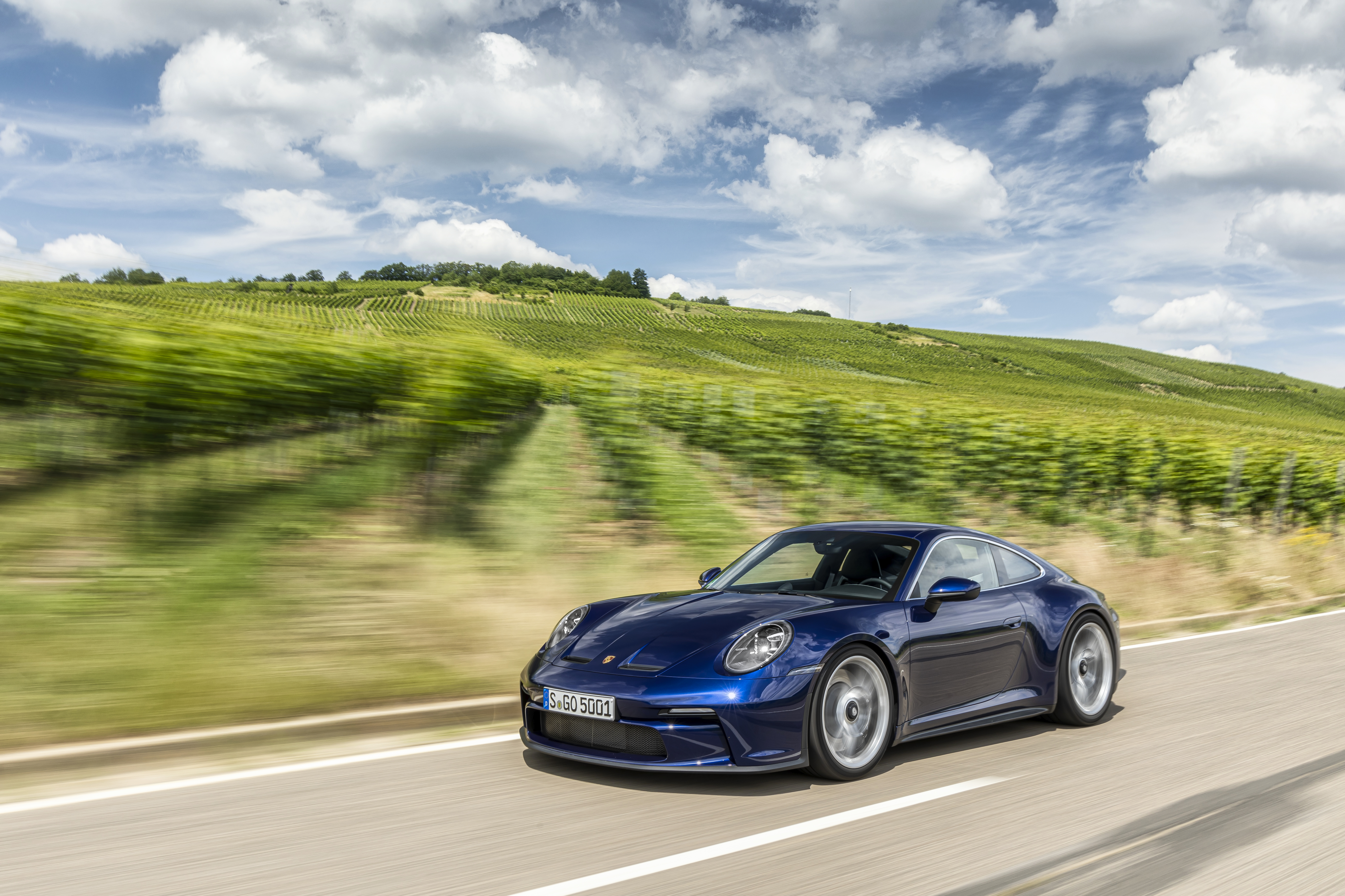 Blue Porsche 911 GT3 Touring driving through vineyards HD Wallpaper