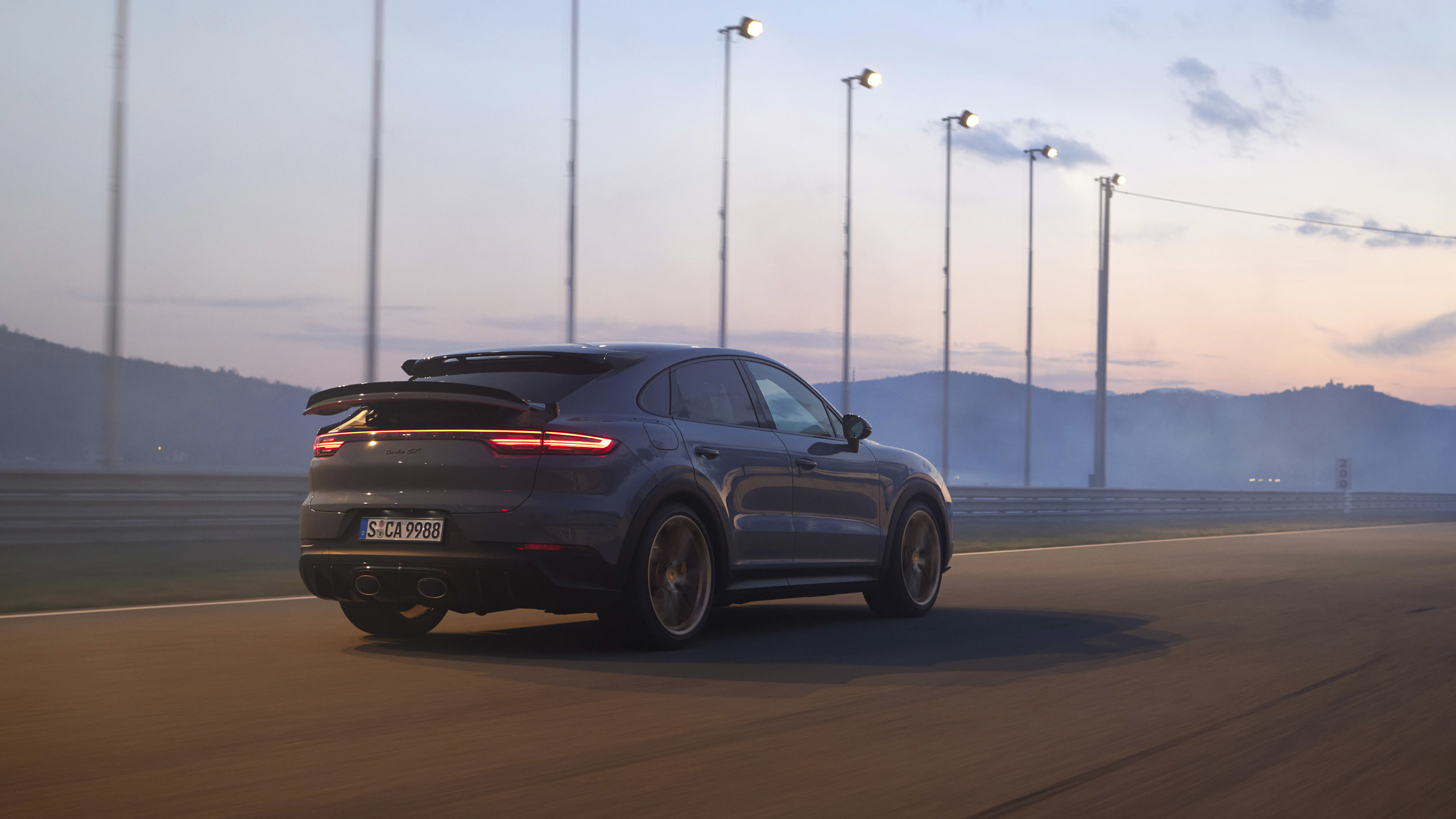 2022 Porsche Cayenne Turbo GT on a race track HD Wallpaper