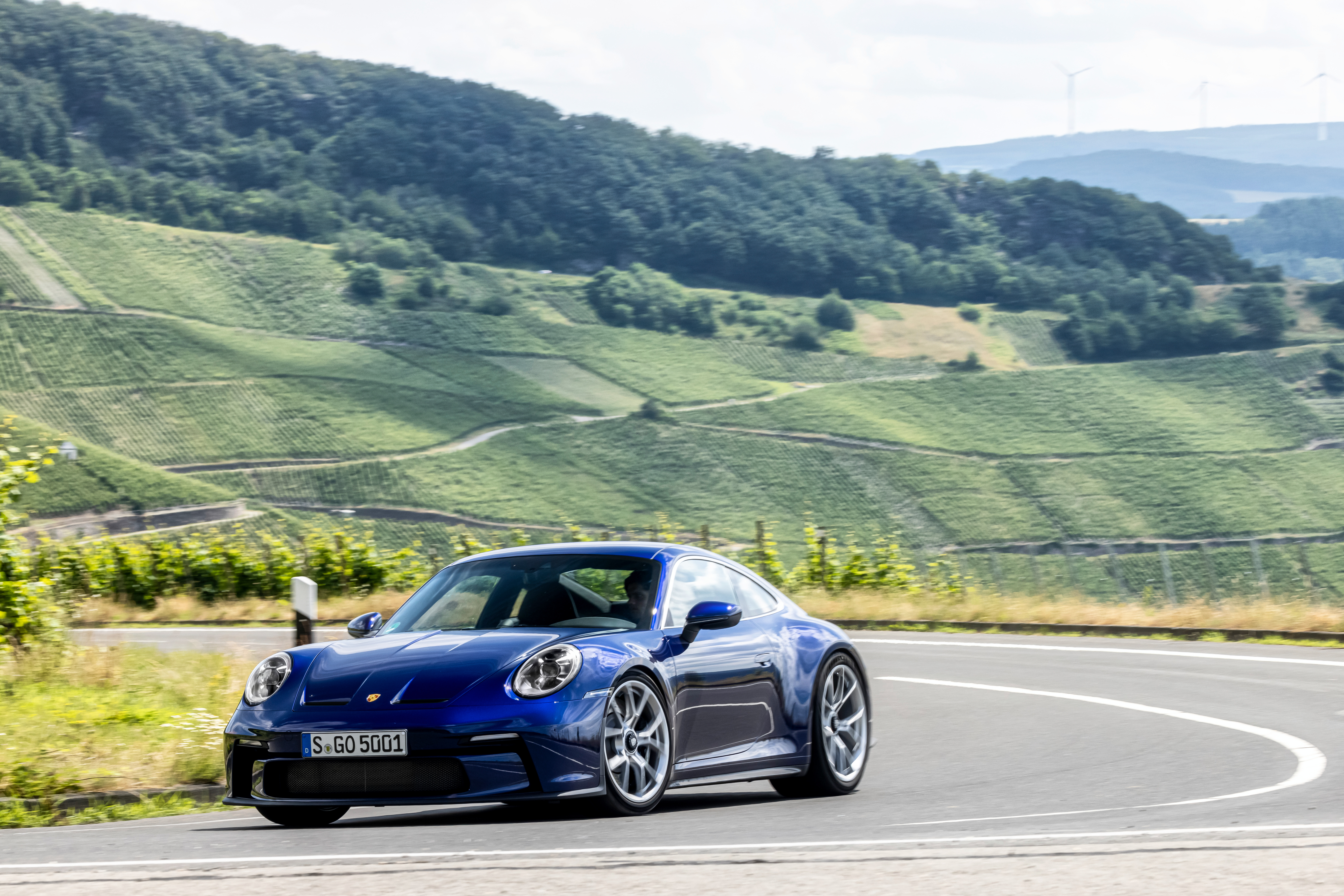 Blue Porsche 911 GT3 Touring on a winding road HD Wallpaper