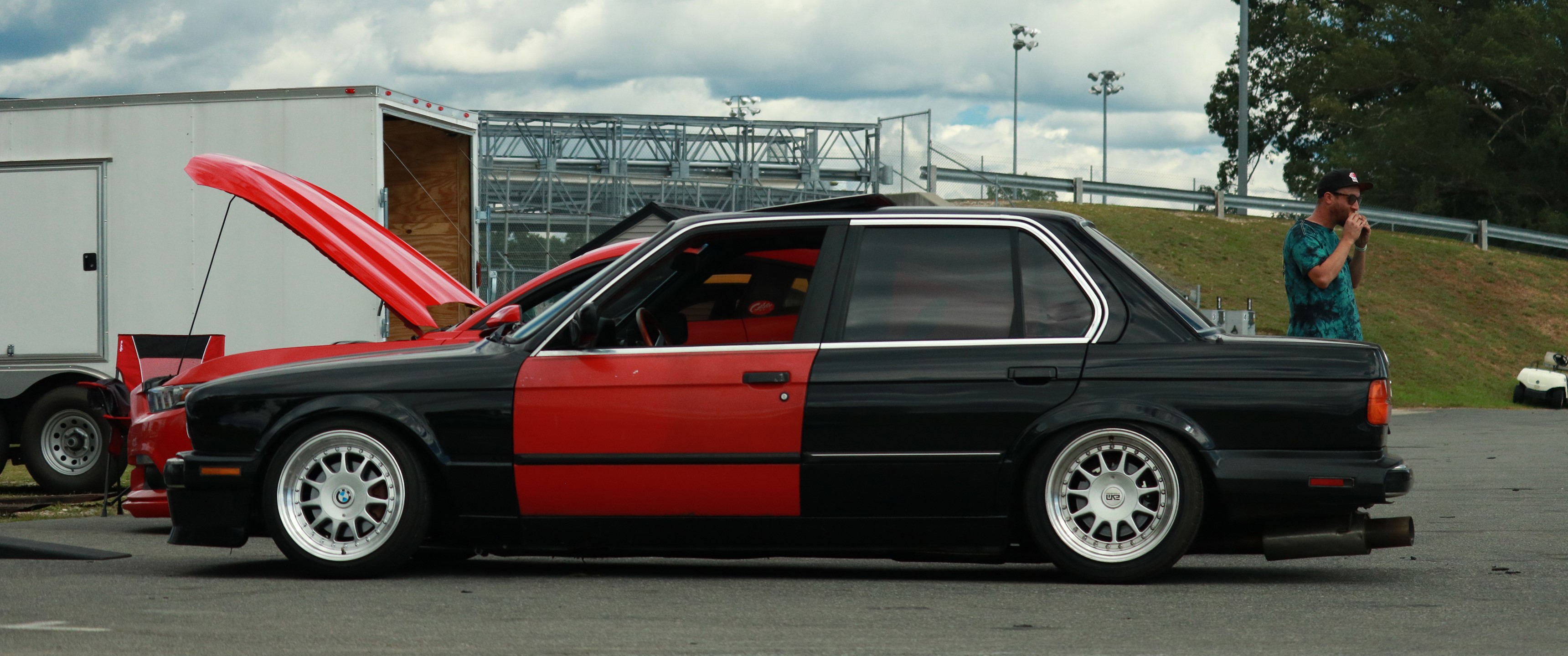 Two-tone BMW E30 sedan with open hood HD Wallpaper