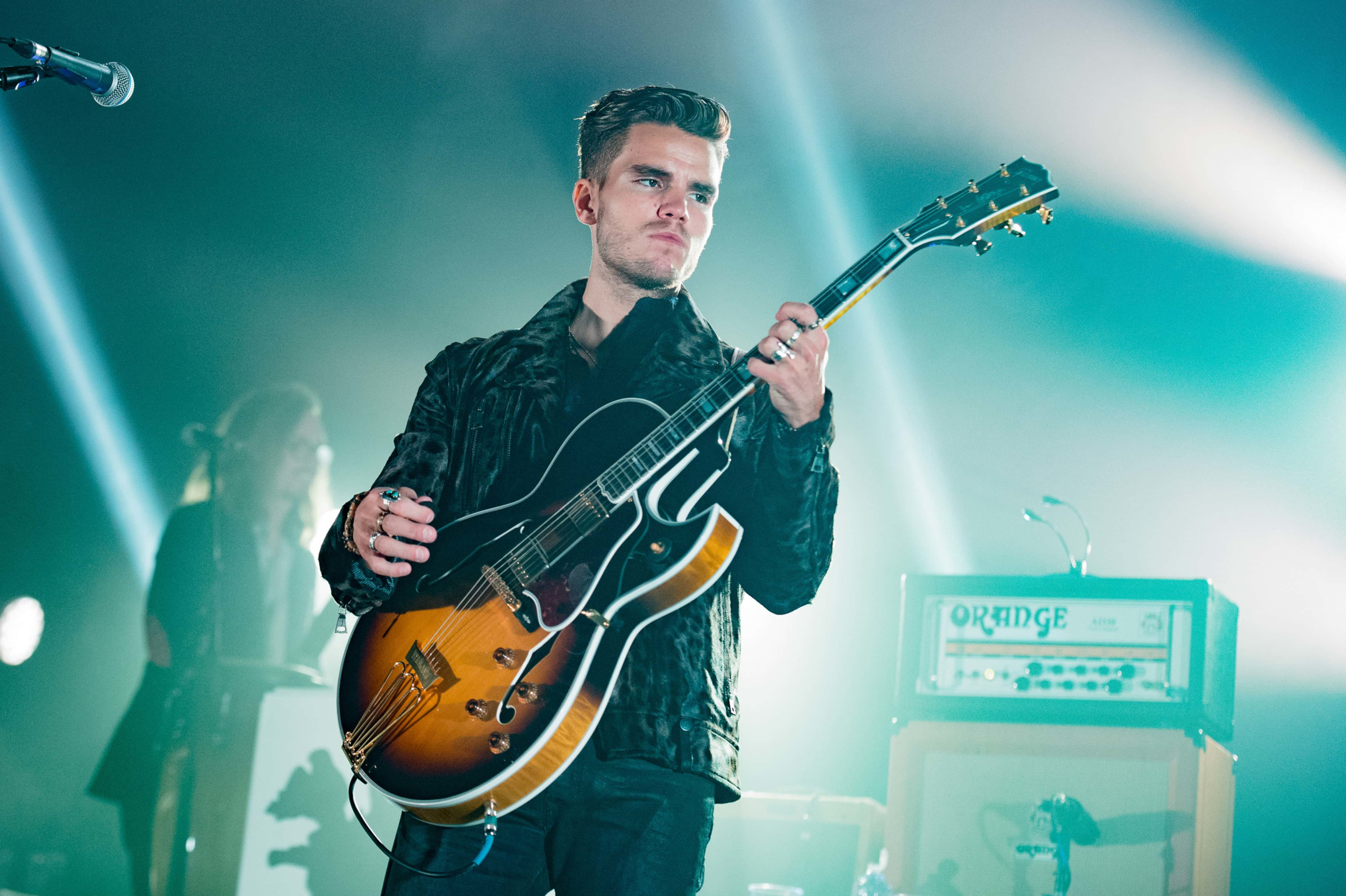 Jökull Júlíusson of KALEO playing guitar on stage HD Wallpaper