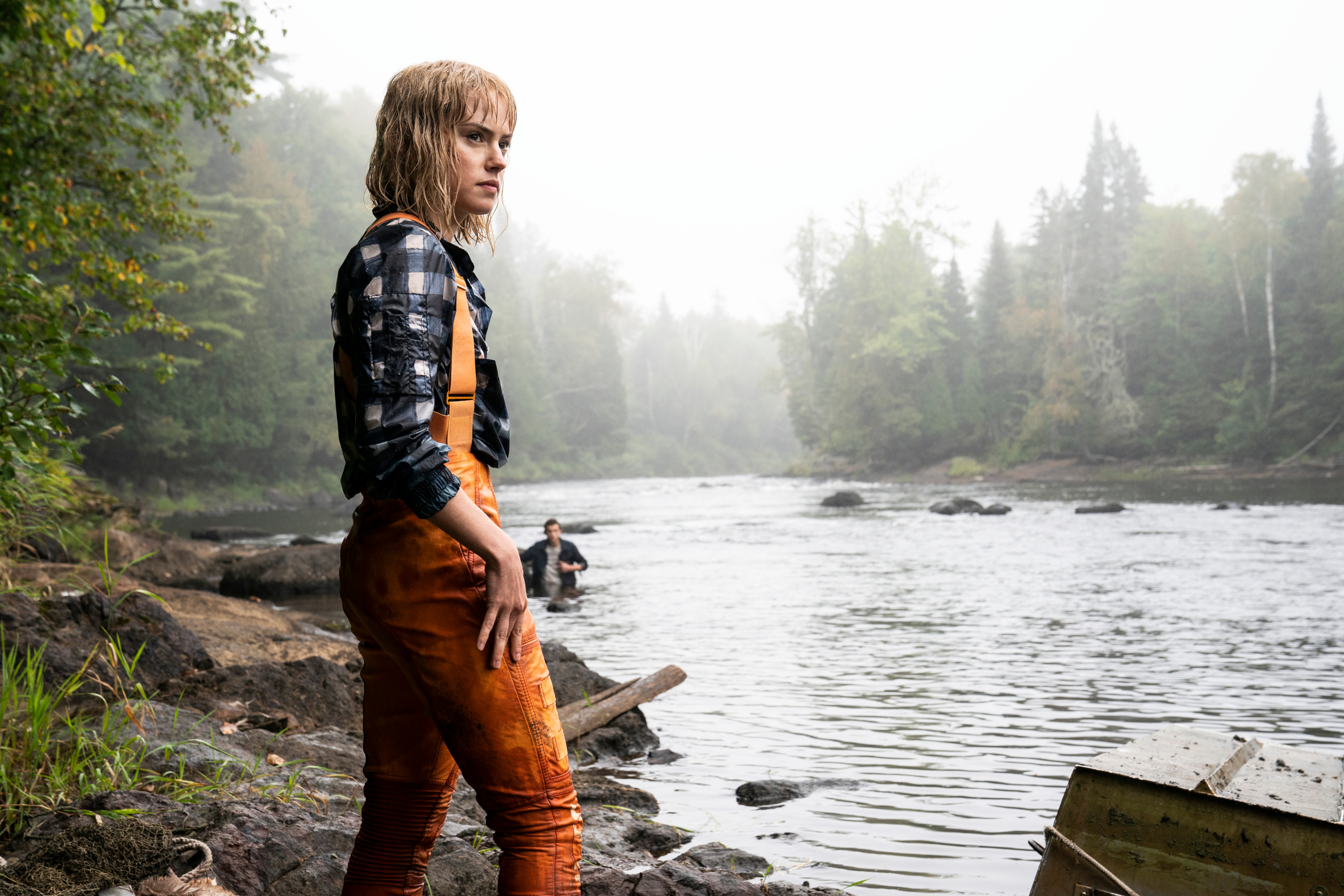 Daisy Ridley in orange overalls by the river HD Wallpaper