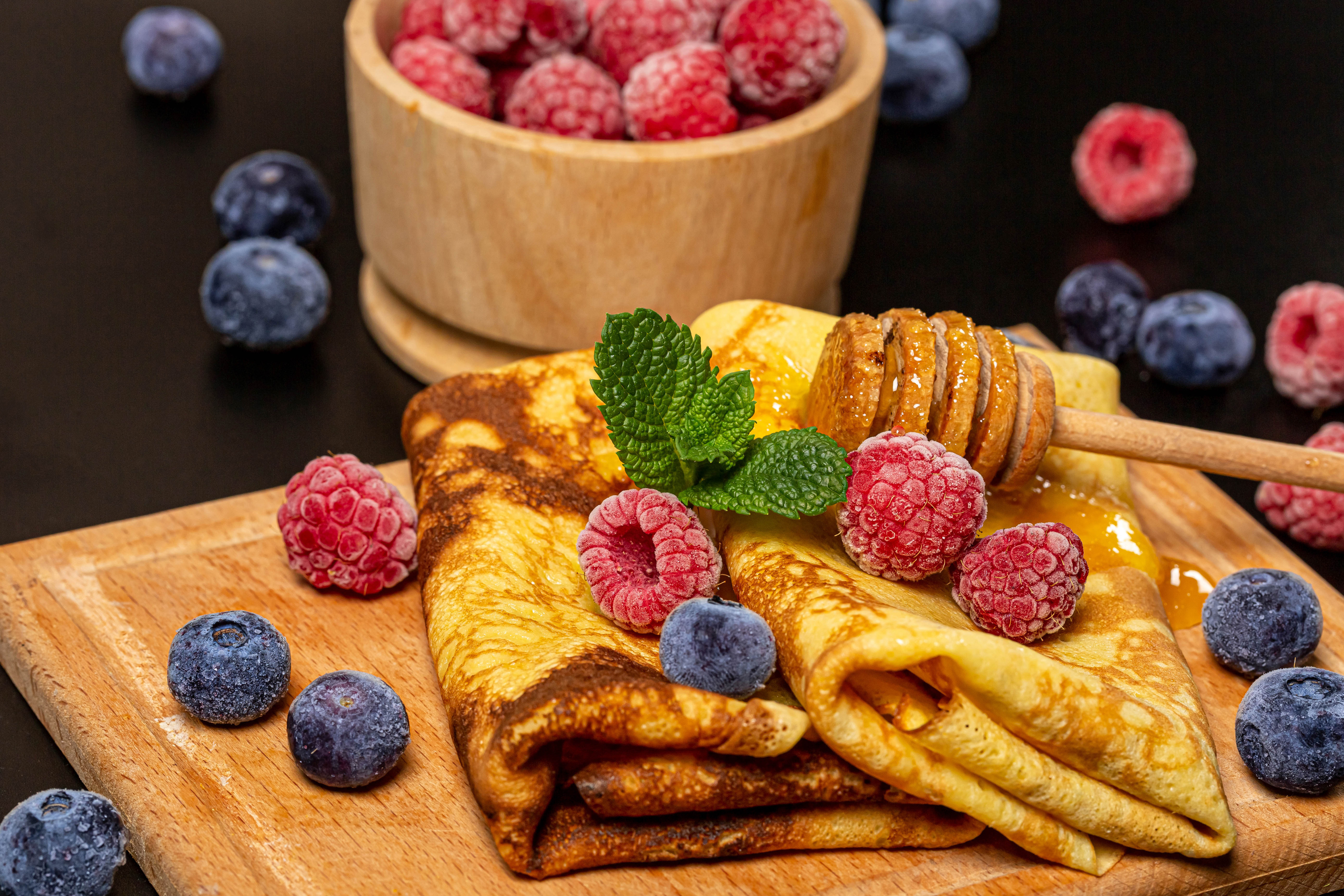 Crepes with raspberries, blueberries, mint, and honey HD Wallpaper
