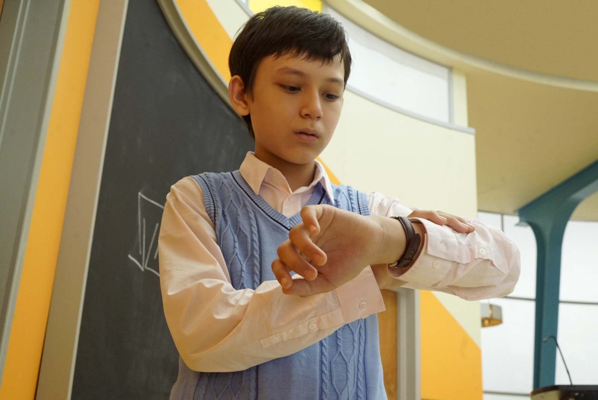 The Mysterious Benedict Society boy checks watch HD Wallpaper