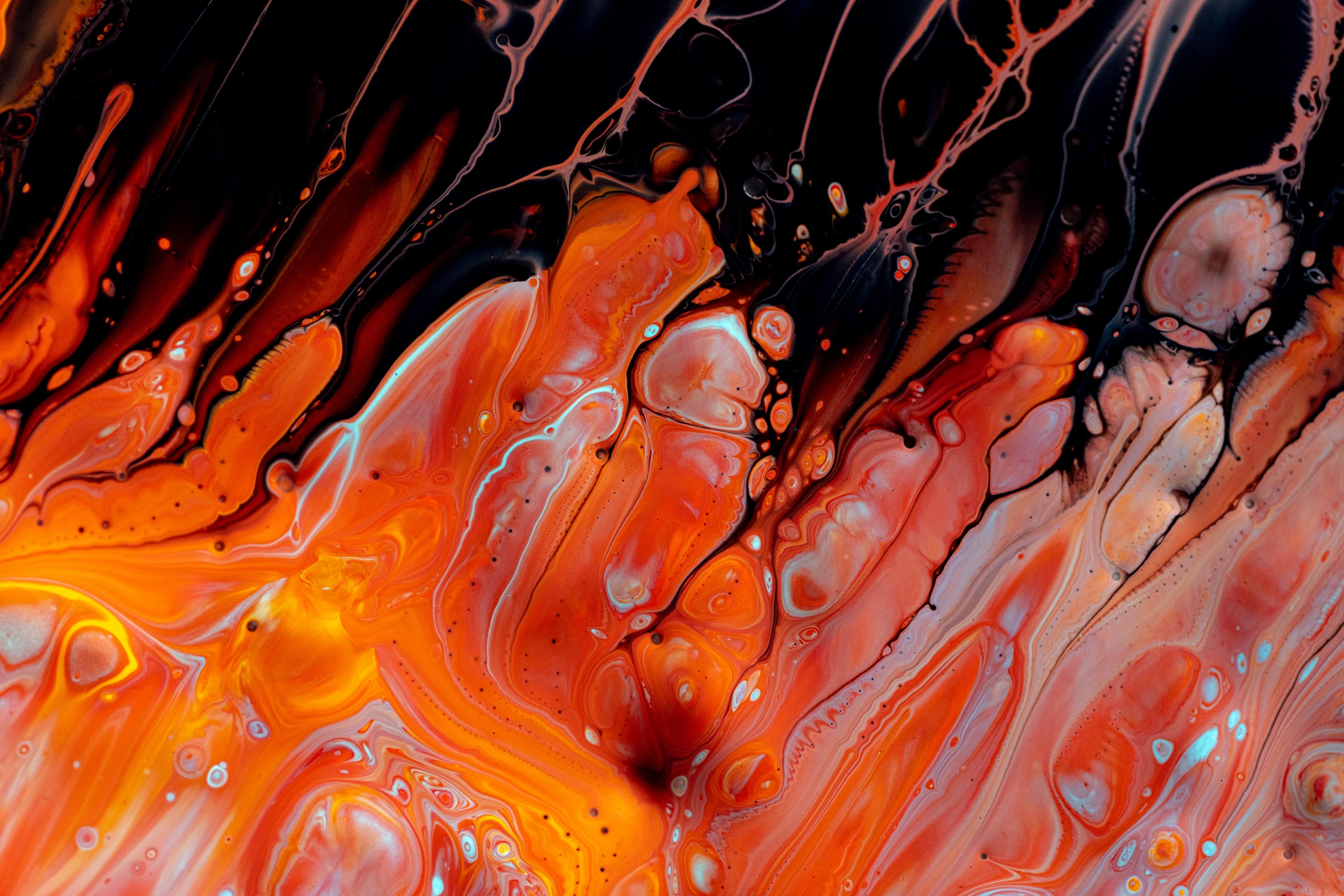 Abstract orange and black paint pour HD Wallpaper