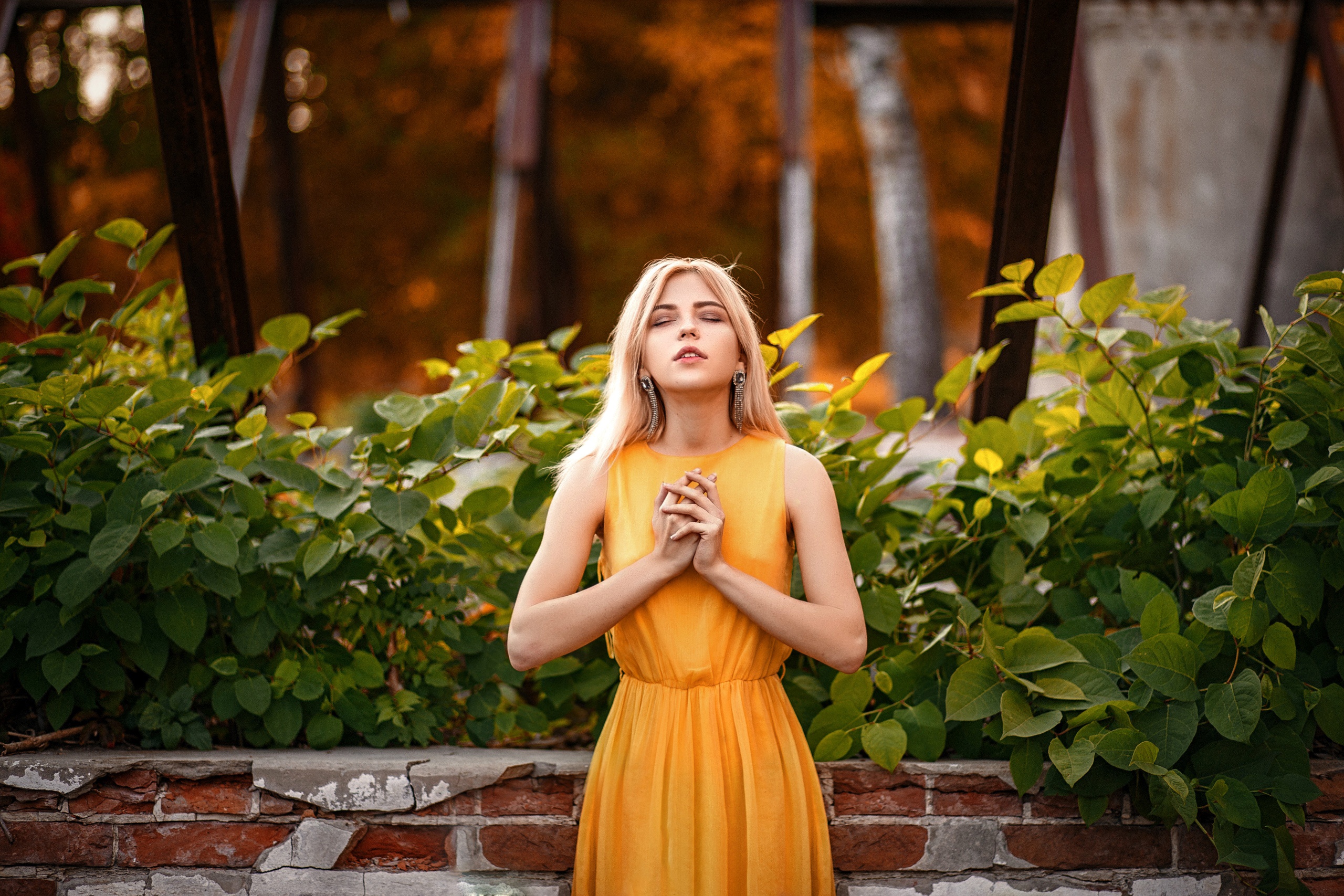 Blonde Model in Yellow Dress Amid Greenery HD Wallpaper