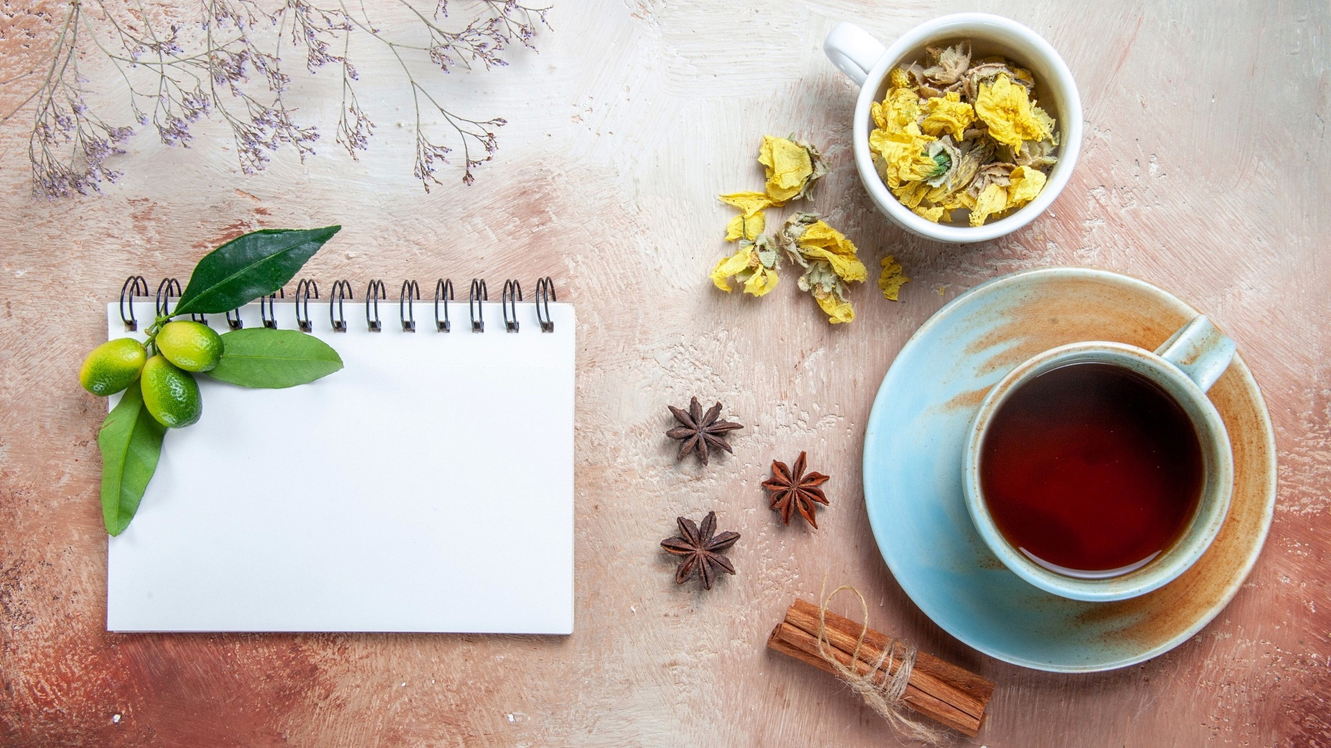 Still life with tea, kumquats, and dried flowers HD Wallpaper