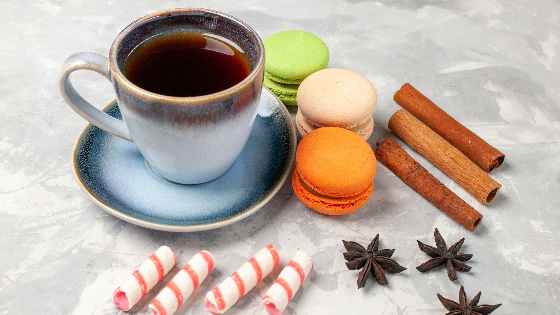 Cup of Tea with Macarons and Cinnamon Sticks HD Wallpaper