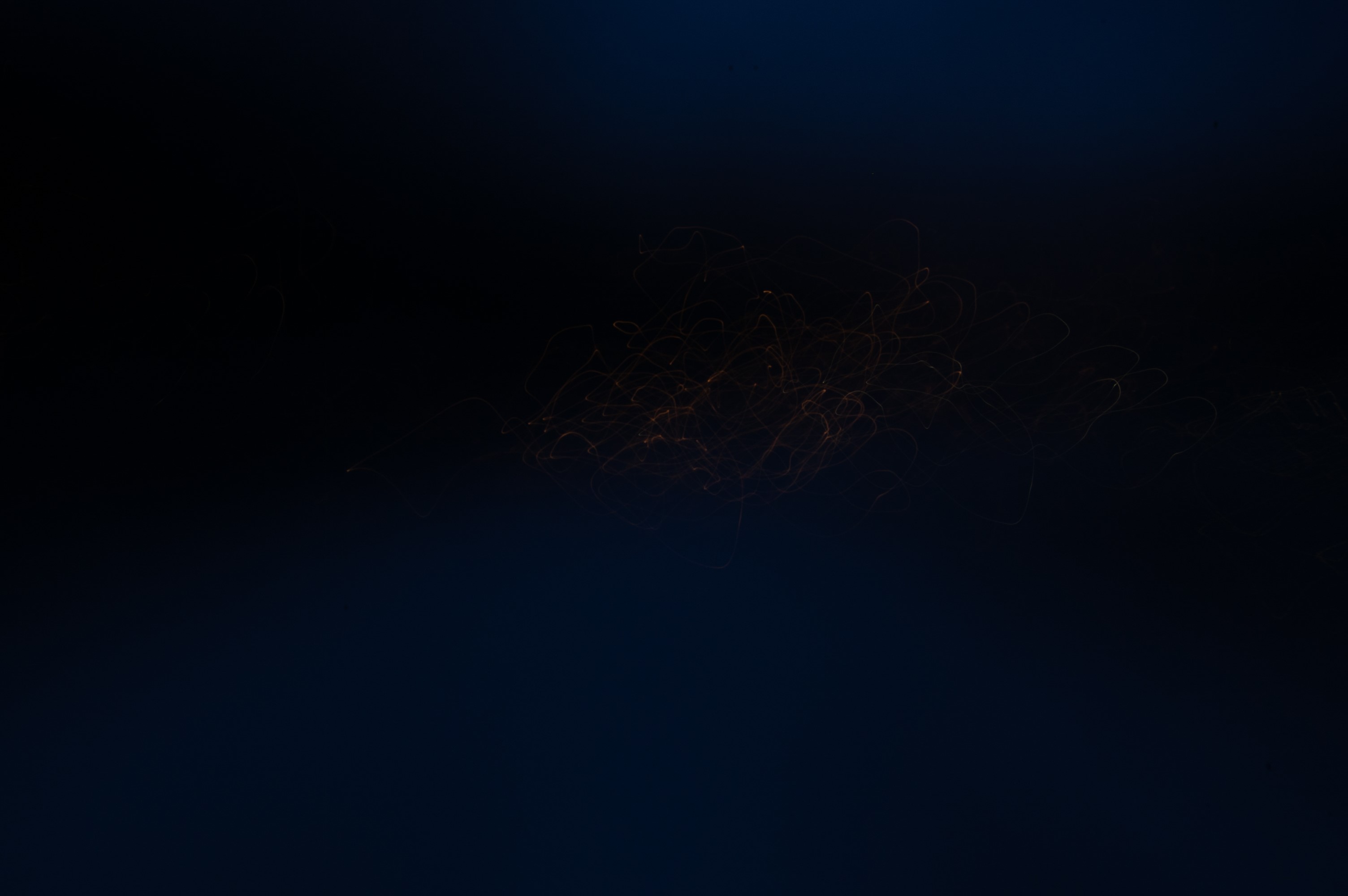 Abstract light trails in dark blue sky HD Wallpaper