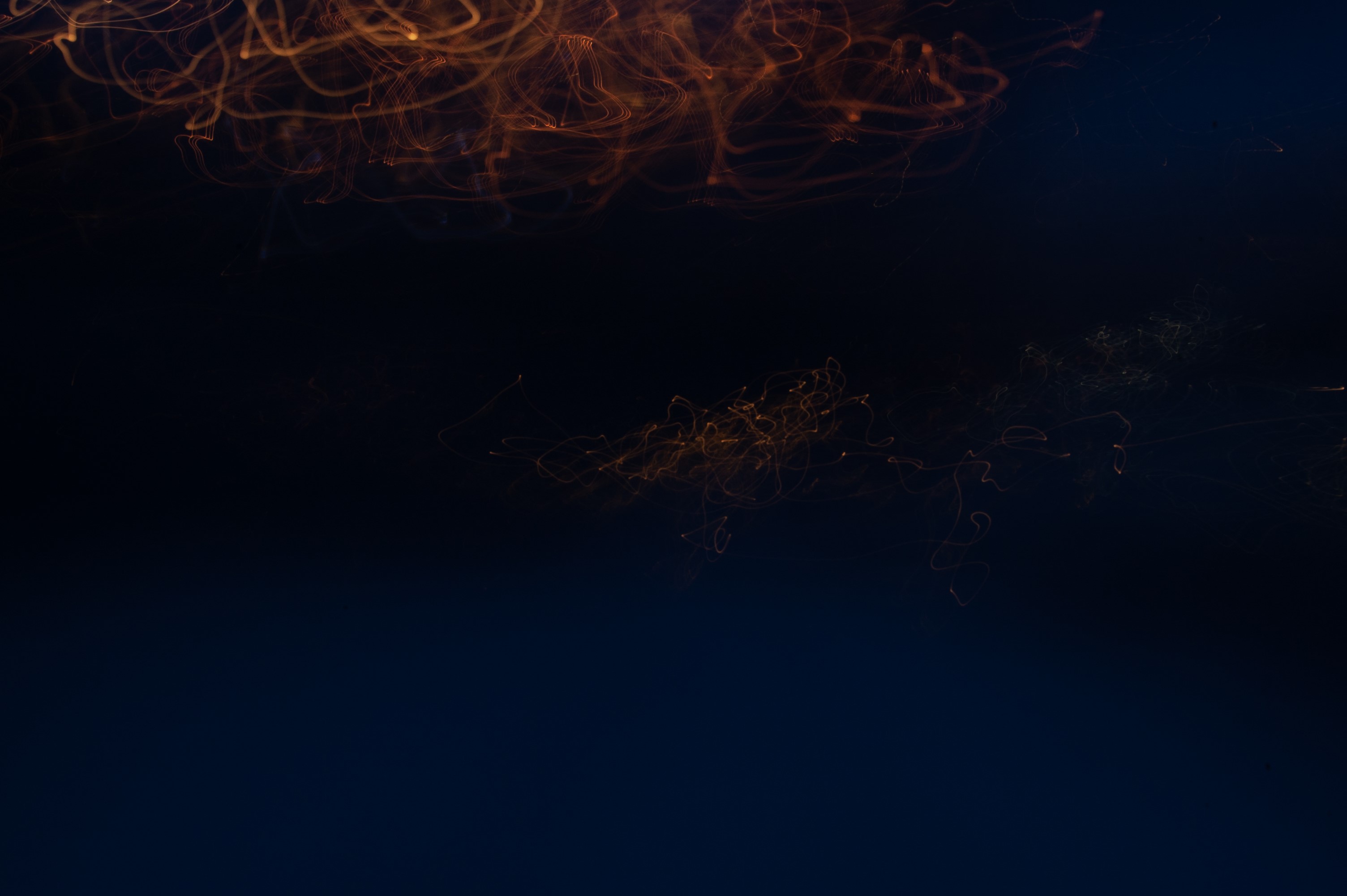 Abstract light trails on dark background HD Wallpaper