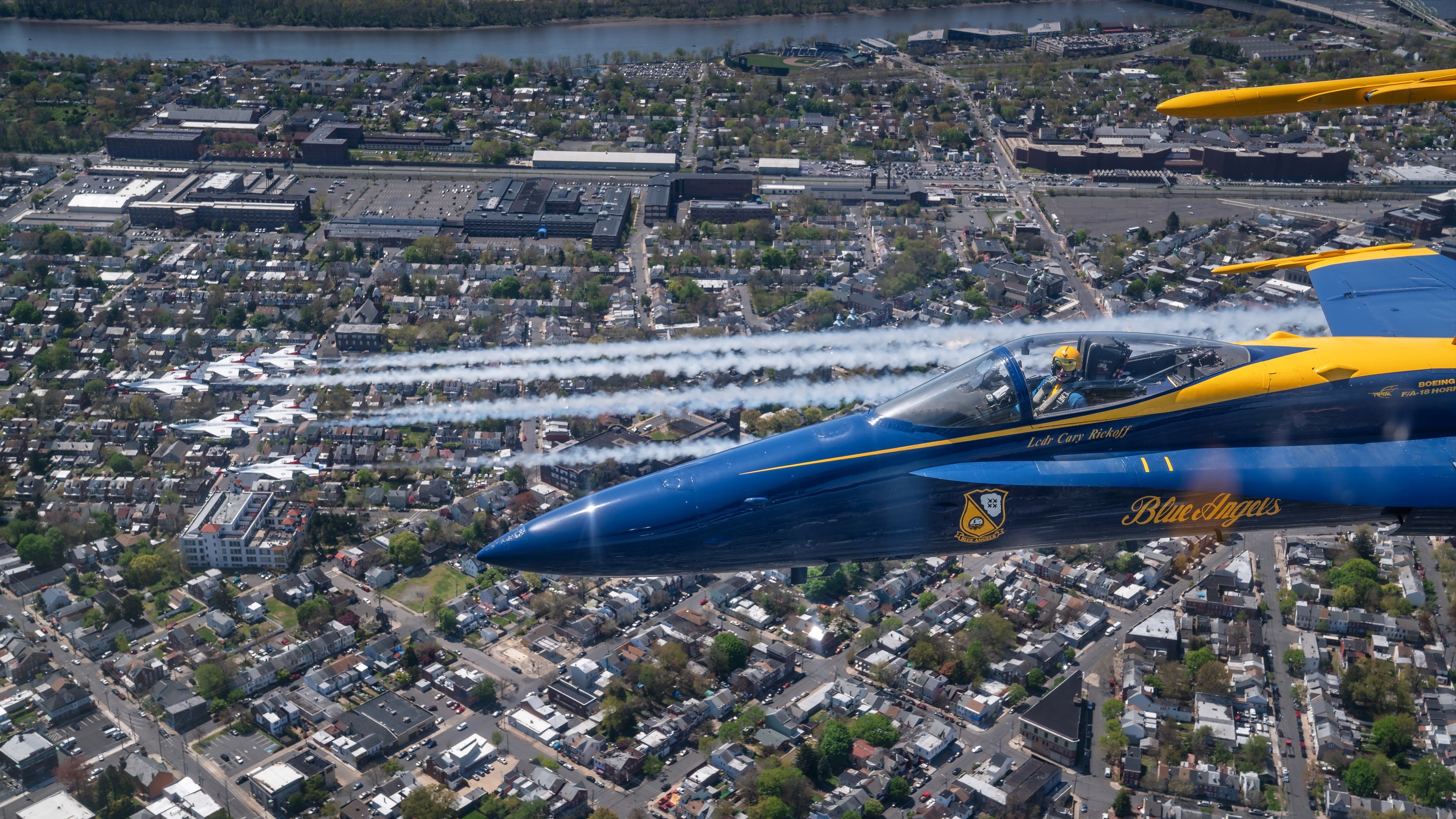 Blue Angels F/A-18 Hornets flying over city HD Wallpaper