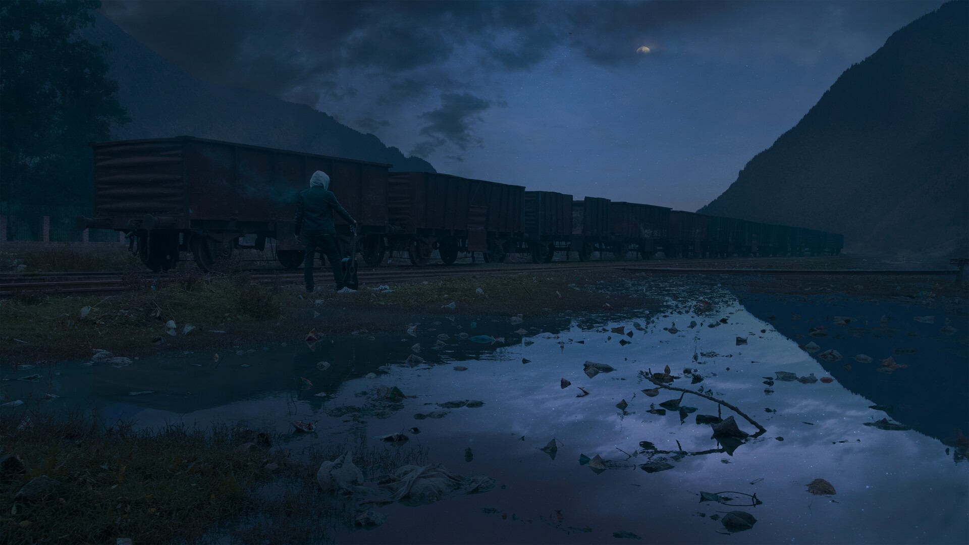 A person standing by a train on a railroad track at night HD Wallpaper
