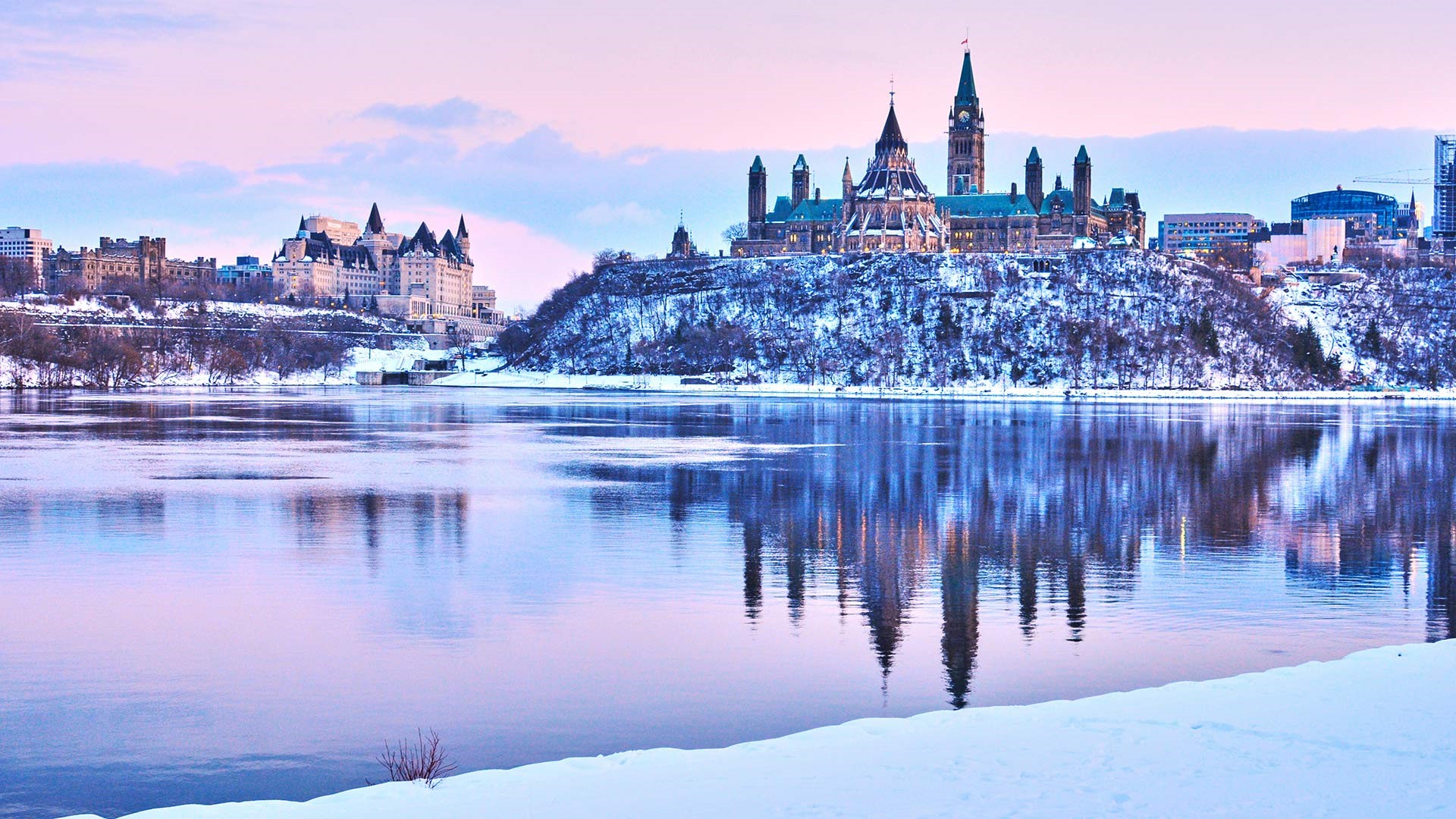 Winter cityscape with Parliament Hill and river in Ottawa HD Wallpaper