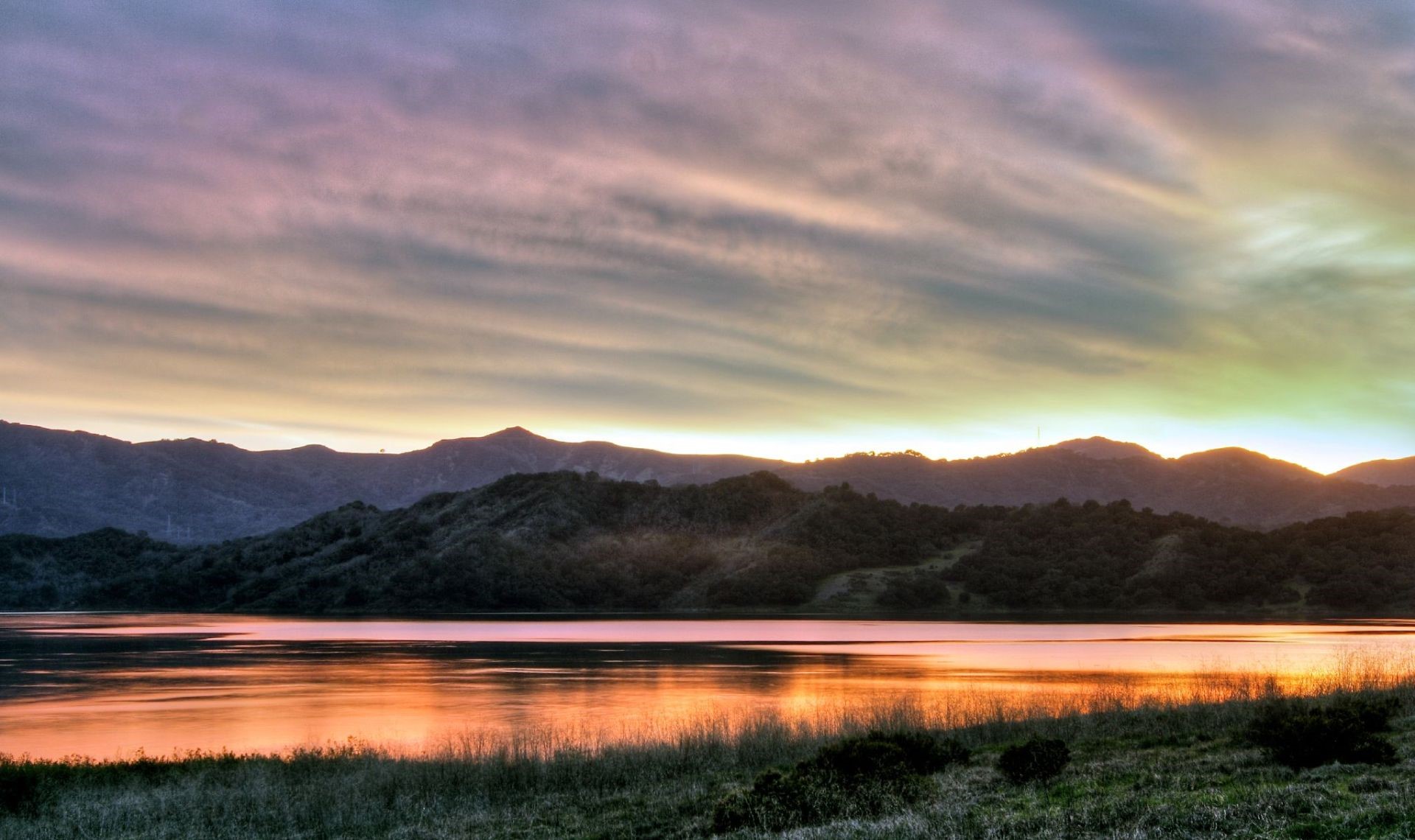 Sunset over a lake and mountains HD Wallpaper