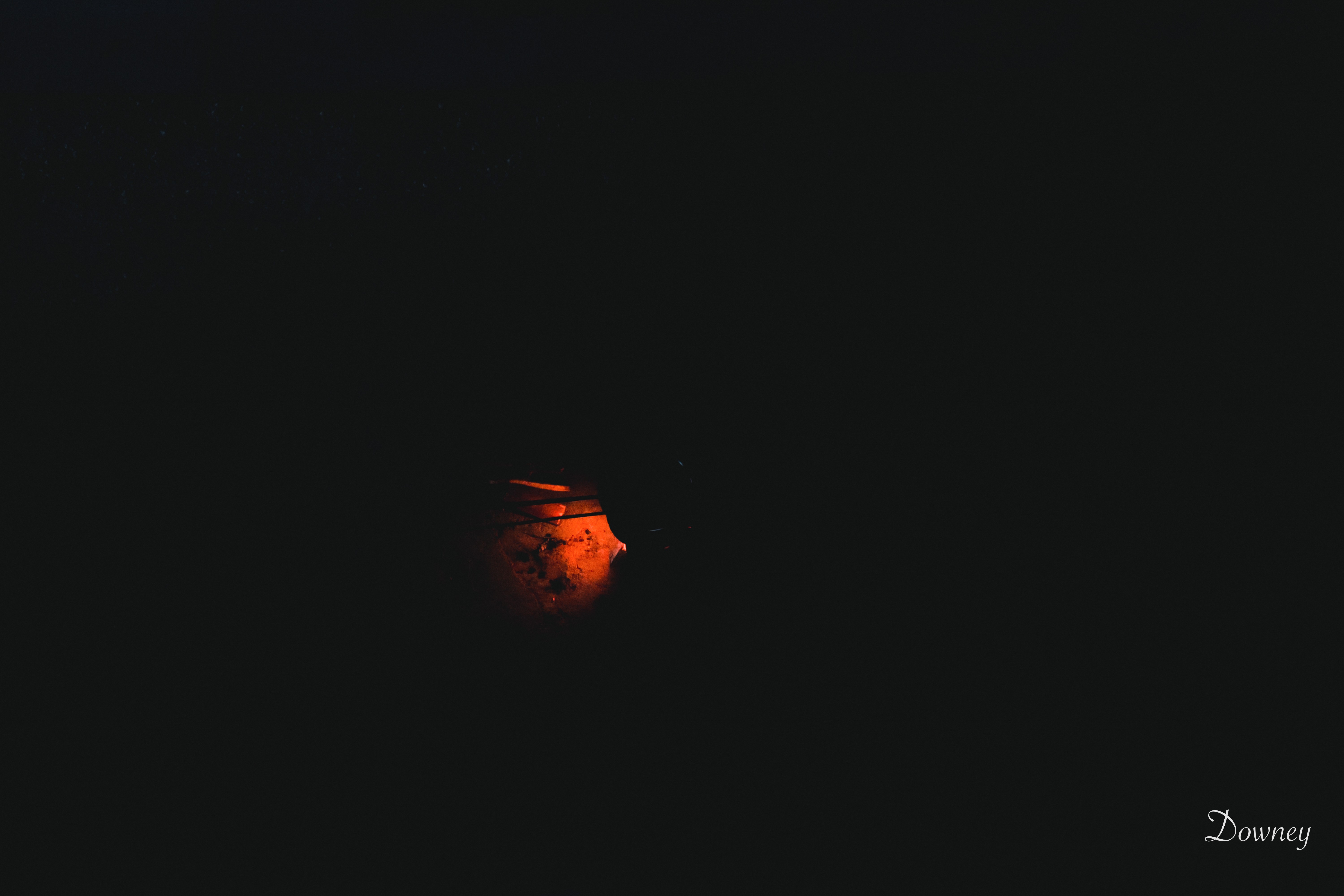 Minimalist dark background with orange glow HD Wallpaper