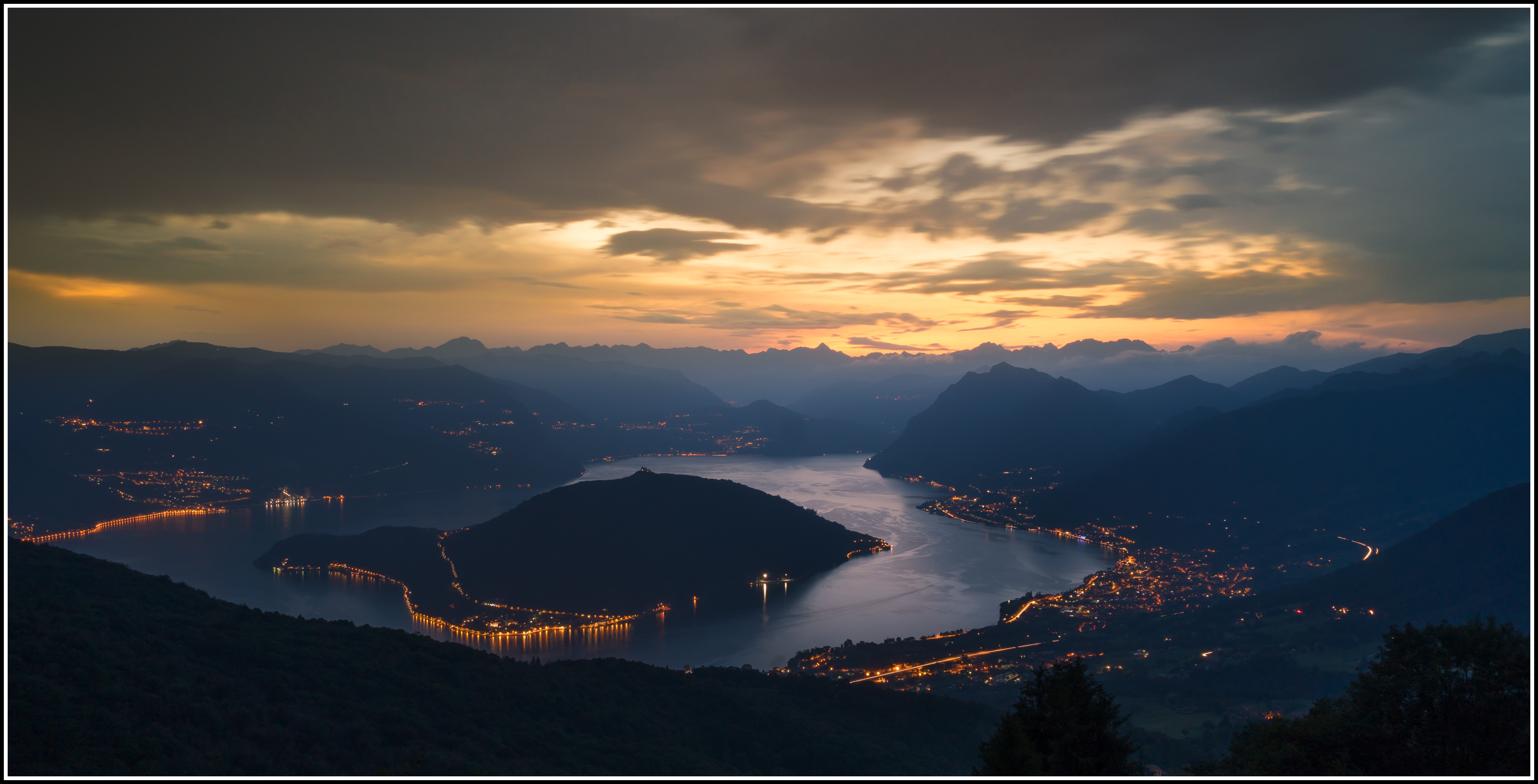 Lake and city lights at sunset in Italy HD Wallpaper