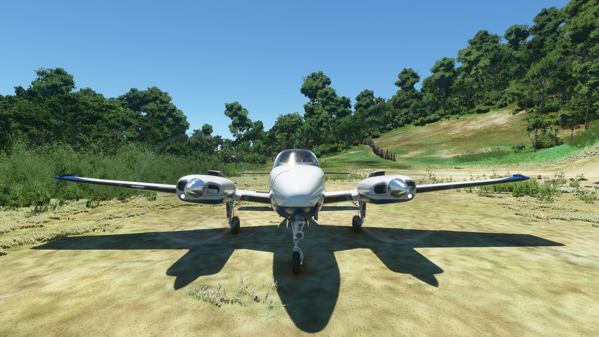 Twin-engine airplane on a dirt runway in Microsoft Flight Simulator HD Wallpaper