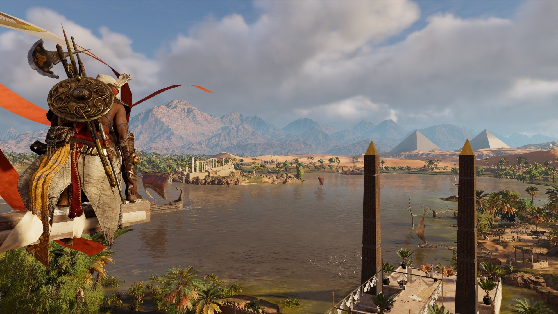 Bayek from Assassin's Creed: Origins overlooking a river with pyramids HD Wallpaper