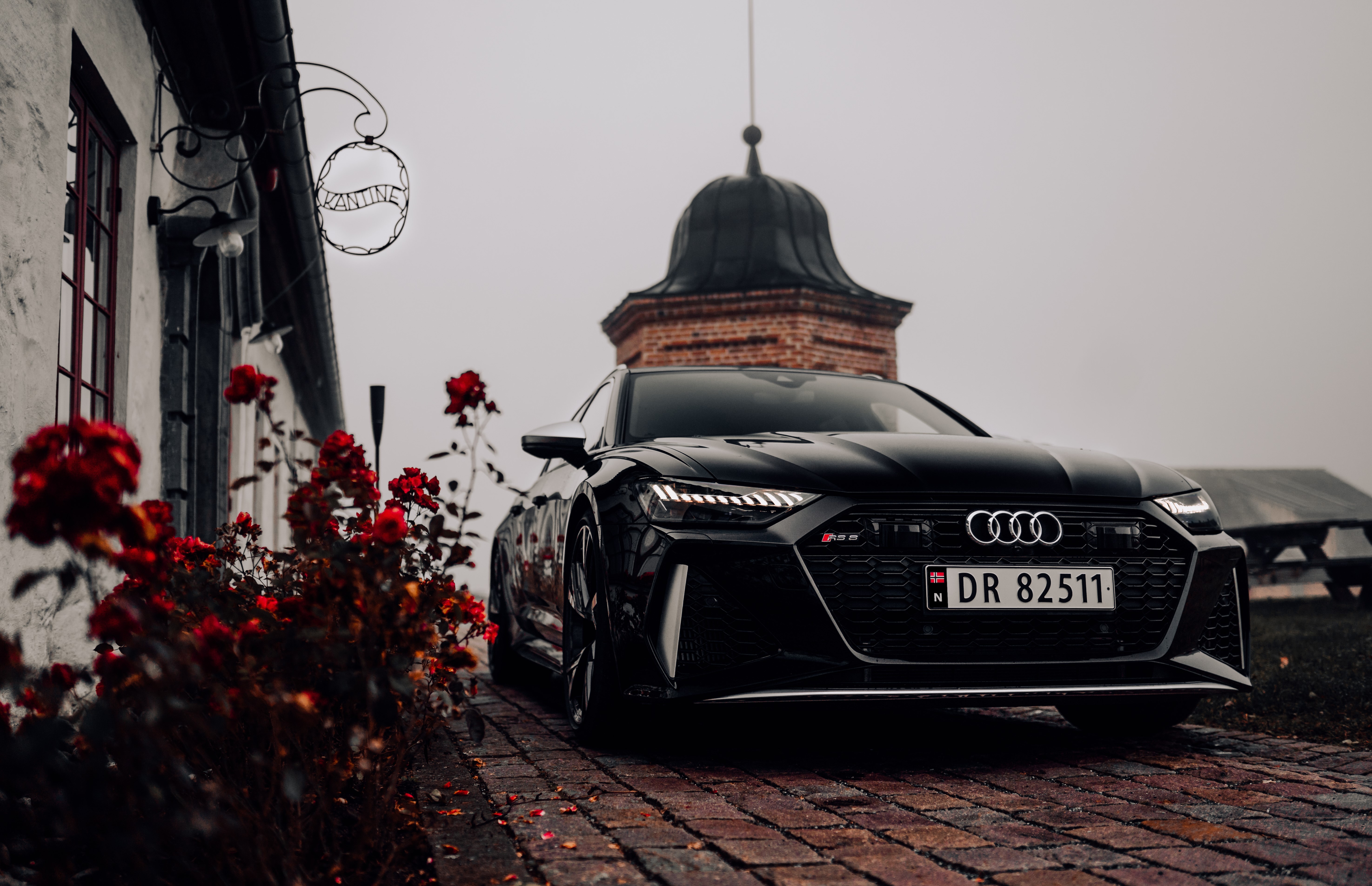 4K Audi RS6 parked near a building with roses HD Wallpaper