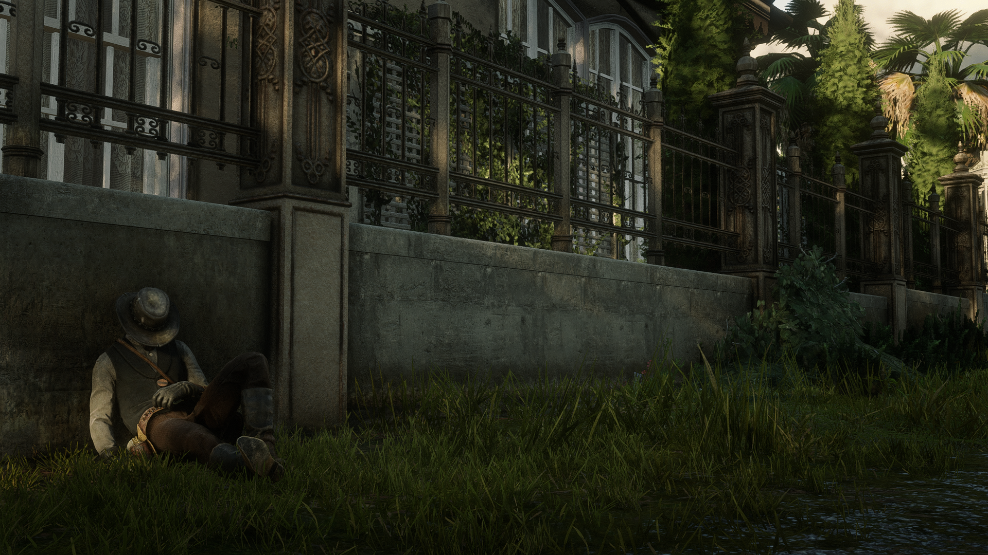 John Marston from Red Dead Redemption 2 sleeping by a wall HD Wallpaper