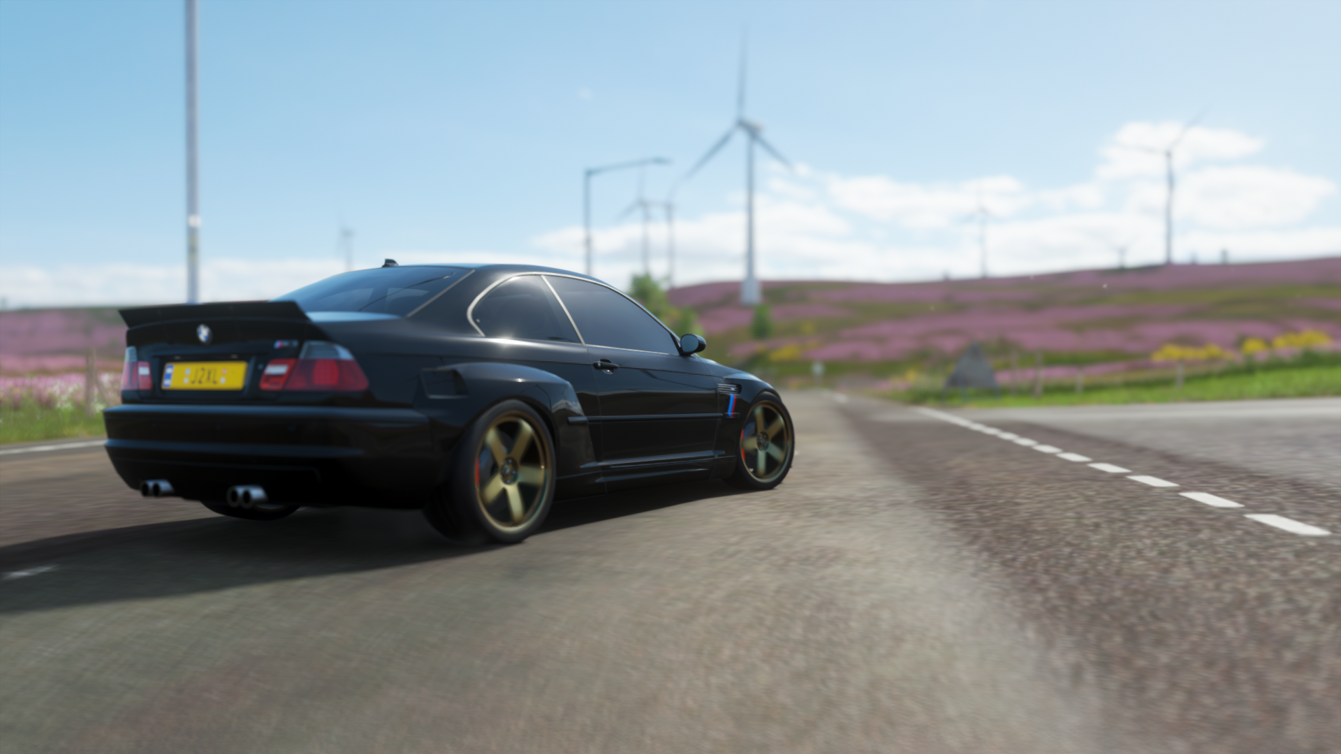 Black BMW M3 E46 on a road with wind turbines HD Wallpaper