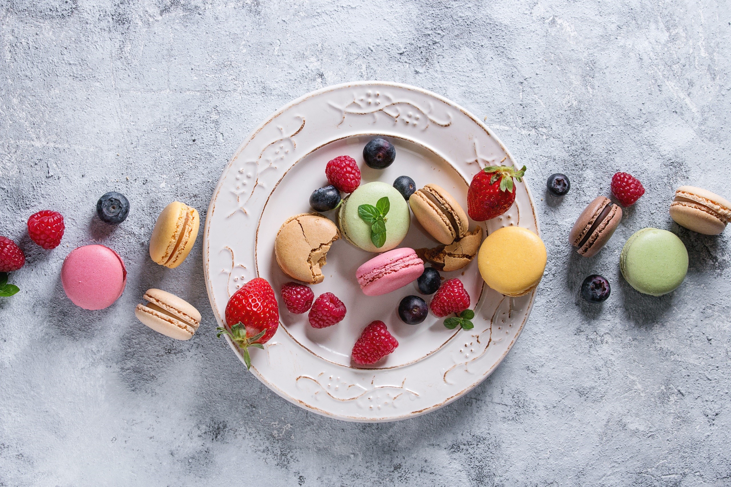 Colorful Macarons and Berries on a Plate HD Wallpaper