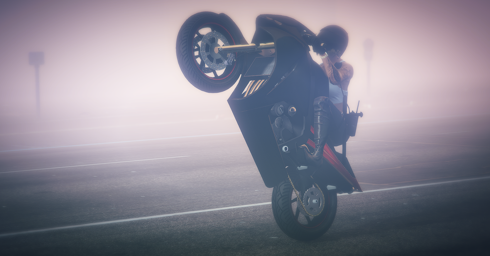 Woman performing a wheelie on a motorcycle in mist HD Wallpaper