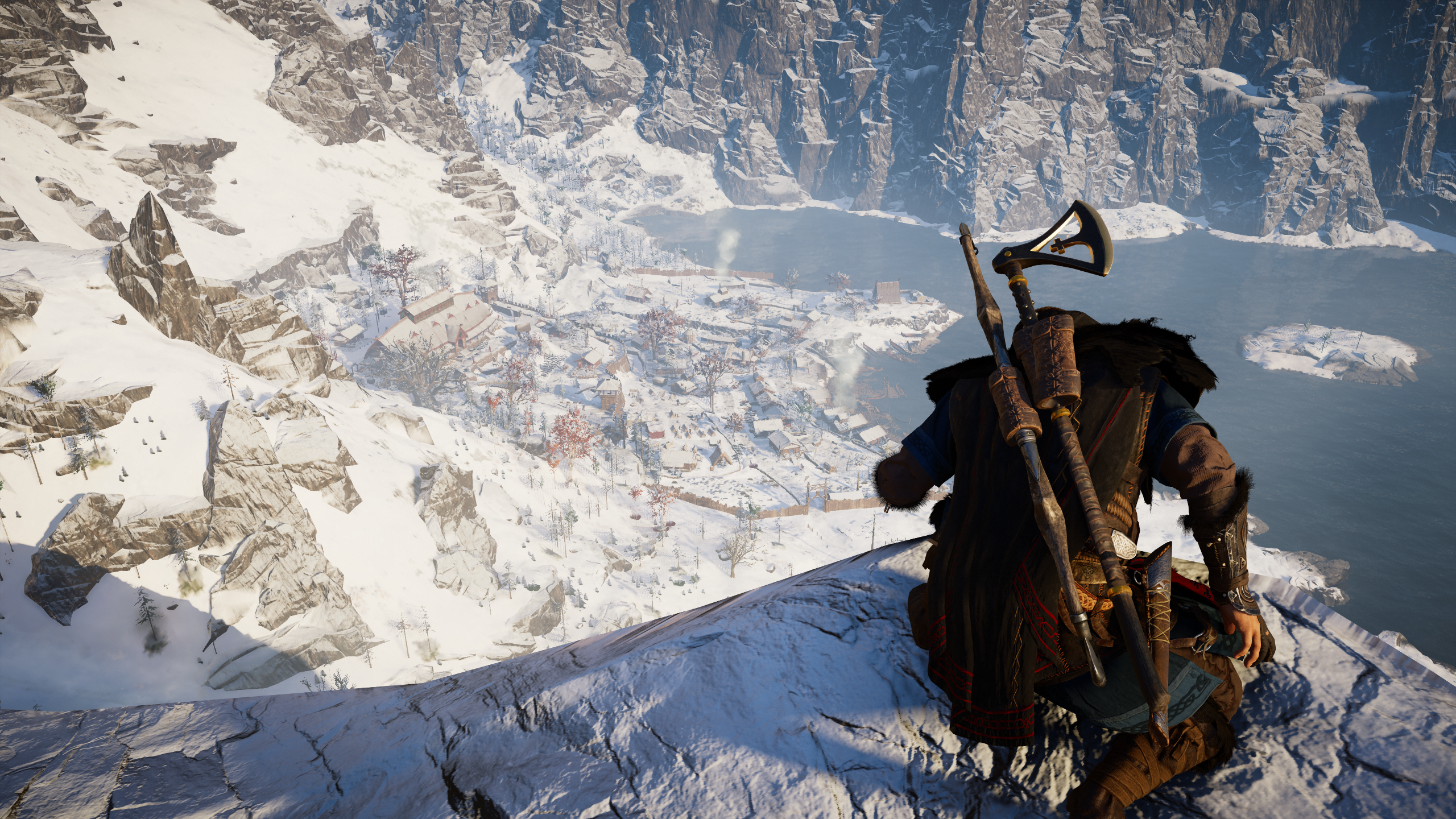 Eivor overlooking a snowy village and fjord HD Wallpaper