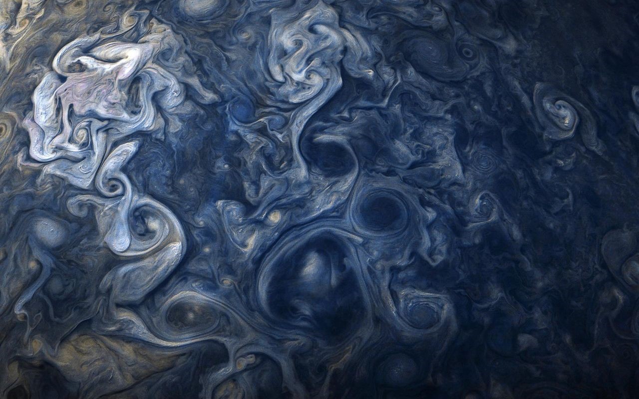 Jupiter's swirling clouds and storms HD Wallpaper