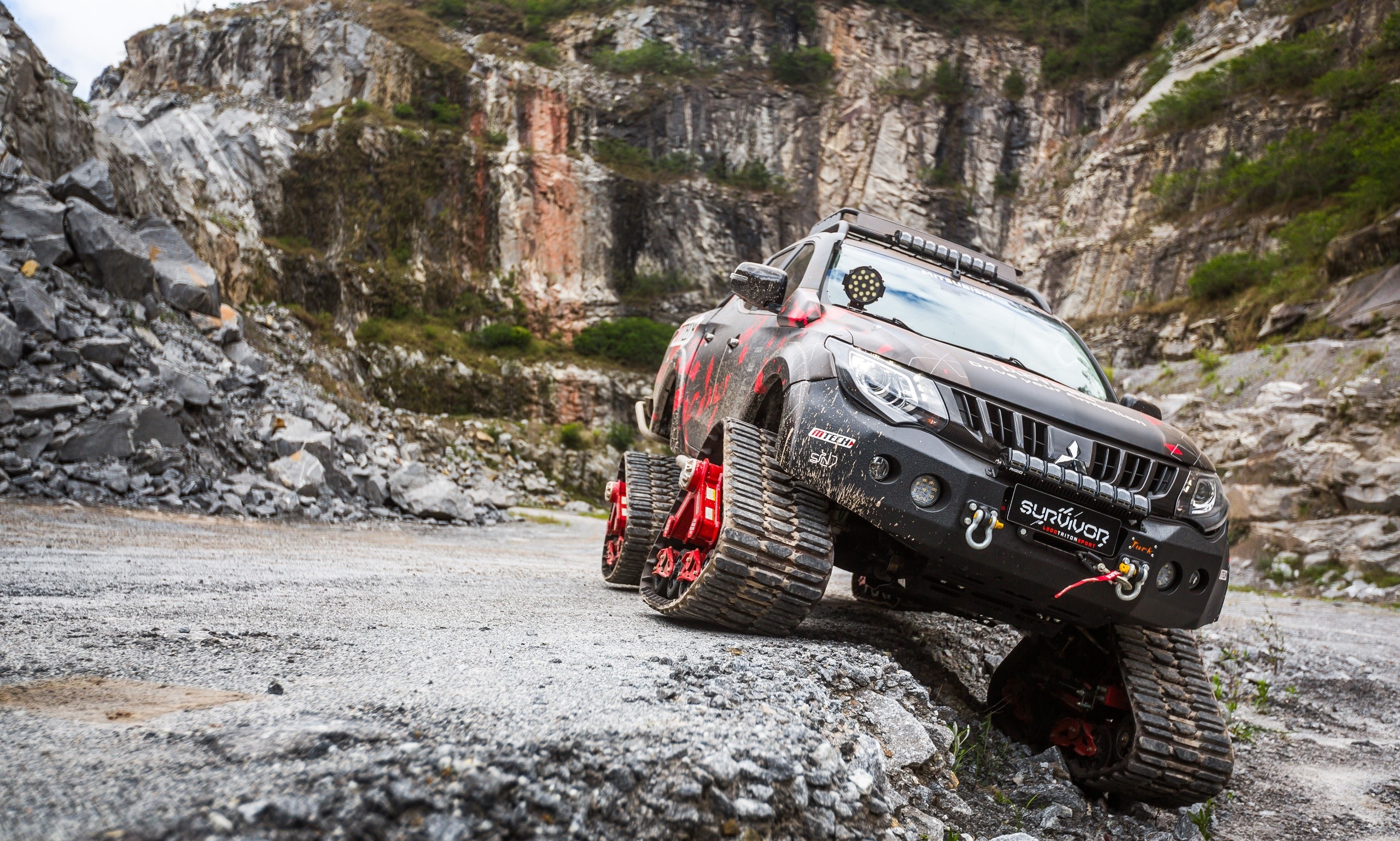 Mitsubishi Triton Survivor off-road vehicle in quarry HD Wallpaper