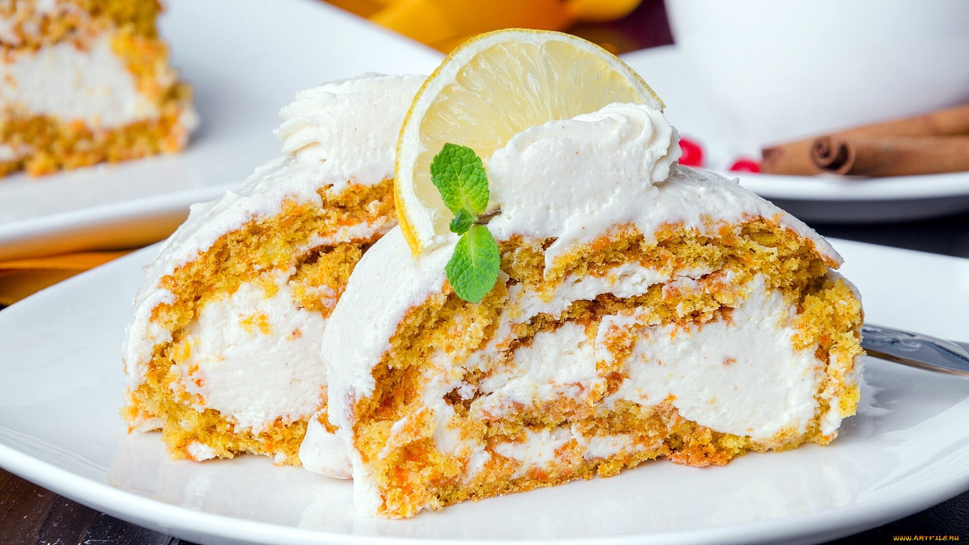 Carrot cake roll with cream cheese frosting and lemon slice HD Wallpaper