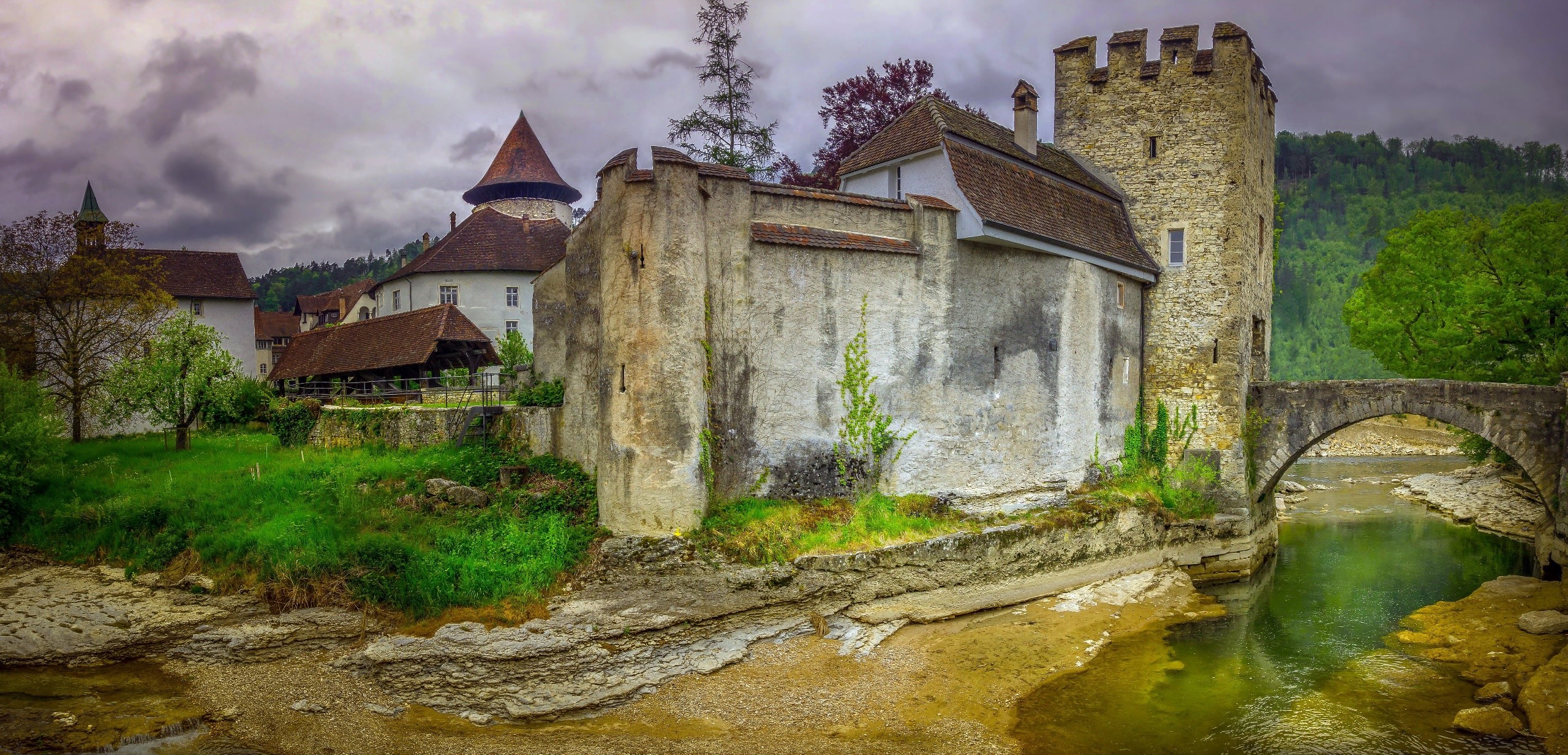 Old castle building in Switzerland by a river HD Wallpaper