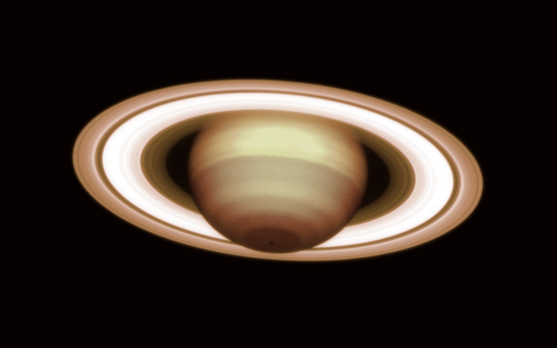 Saturn and its rings in space HD Wallpaper