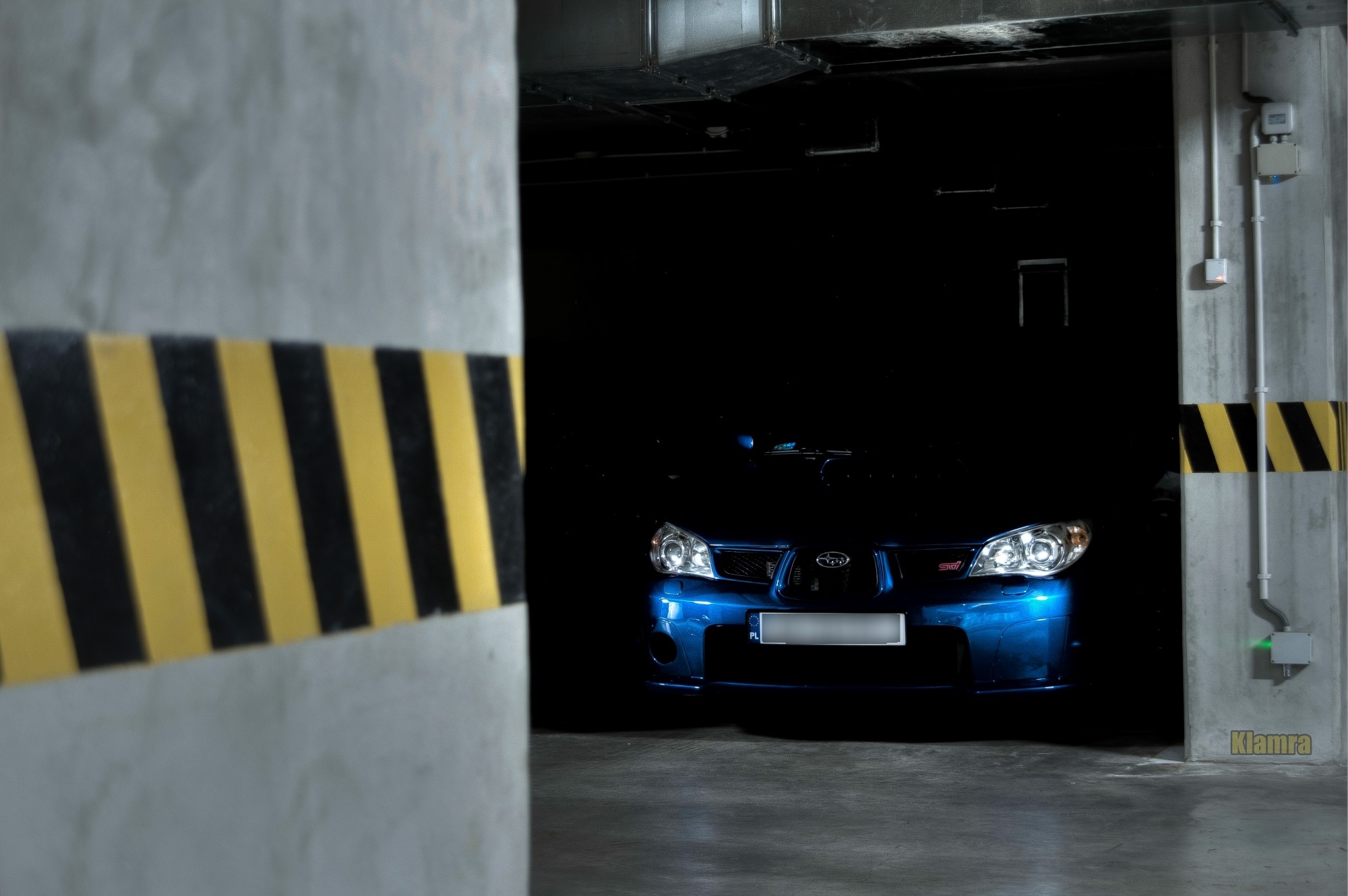 Blue Subaru Impreza WRX STi in a parking garage HD Wallpaper