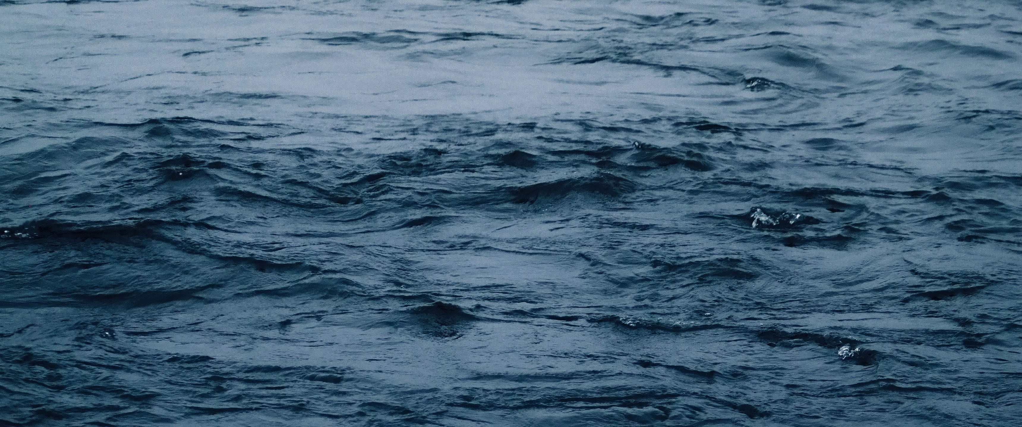Dark blue water with ripples HD Wallpaper