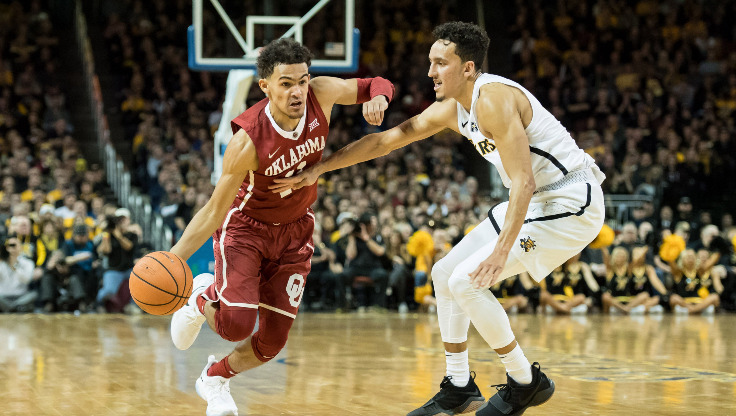 Oklahoma Sooners basketball player Trae Young dribbles the ball HD Wallpaper