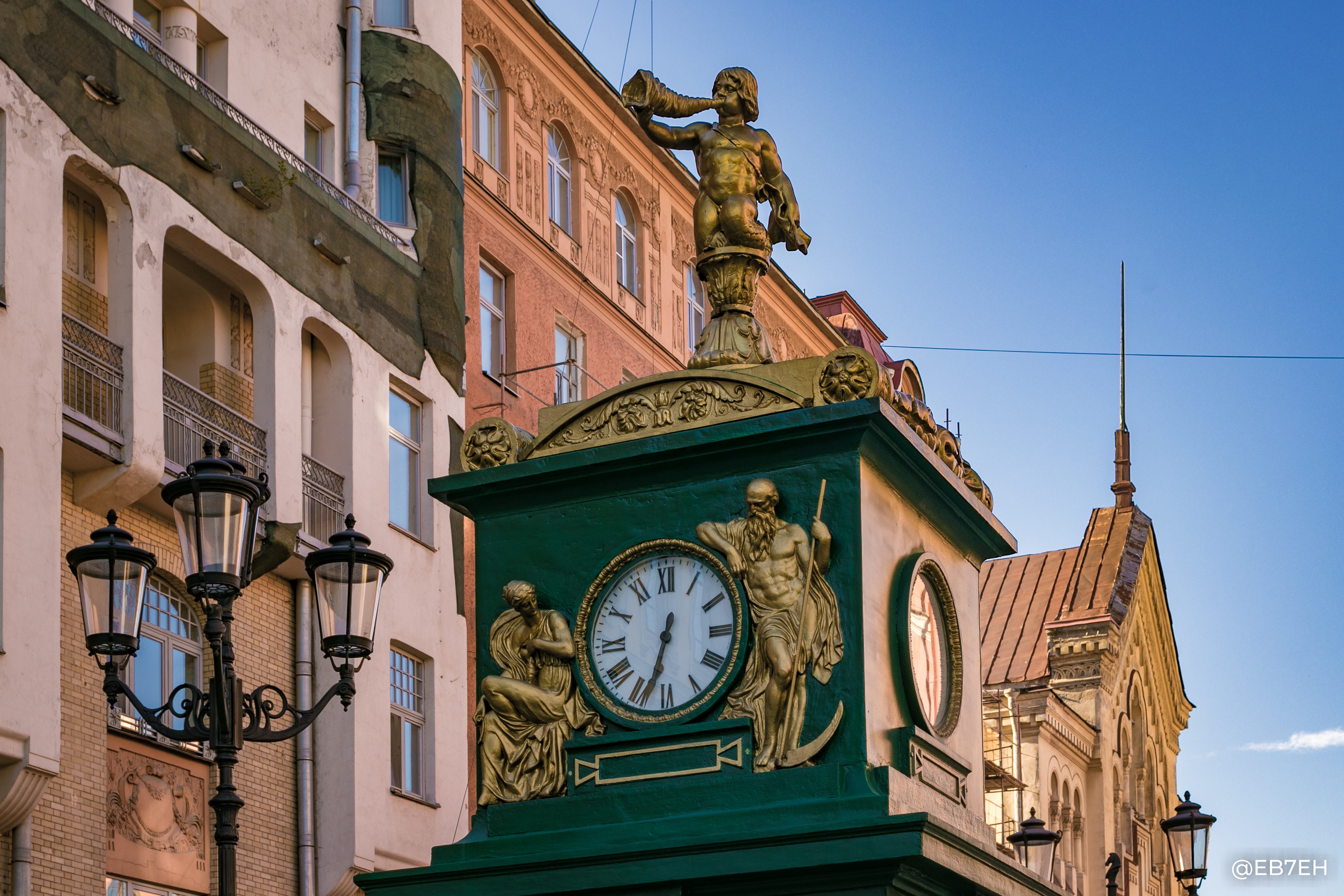 Clock tower with statues and buildings in Russia HD Wallpaper