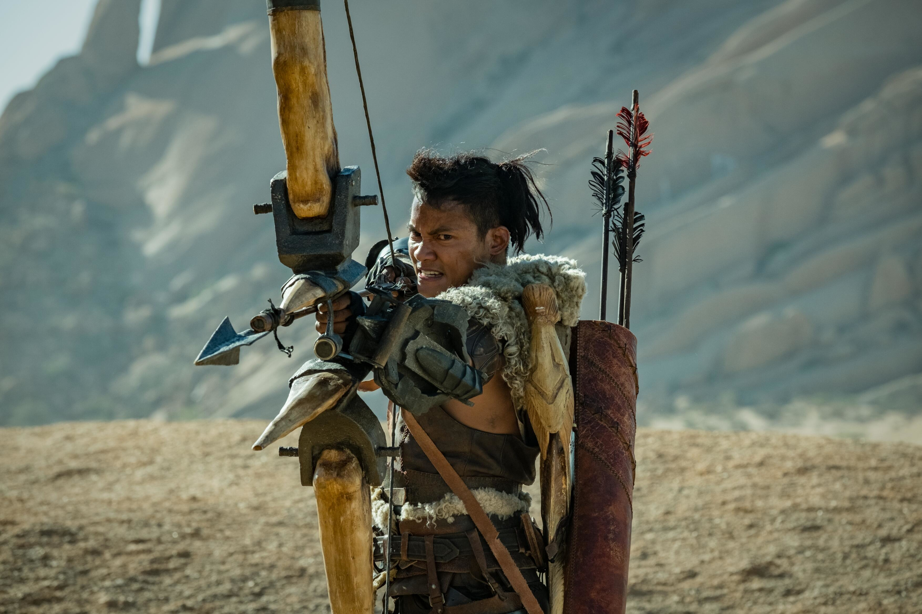 Tony Jaa with bow and arrows in desert HD Wallpaper